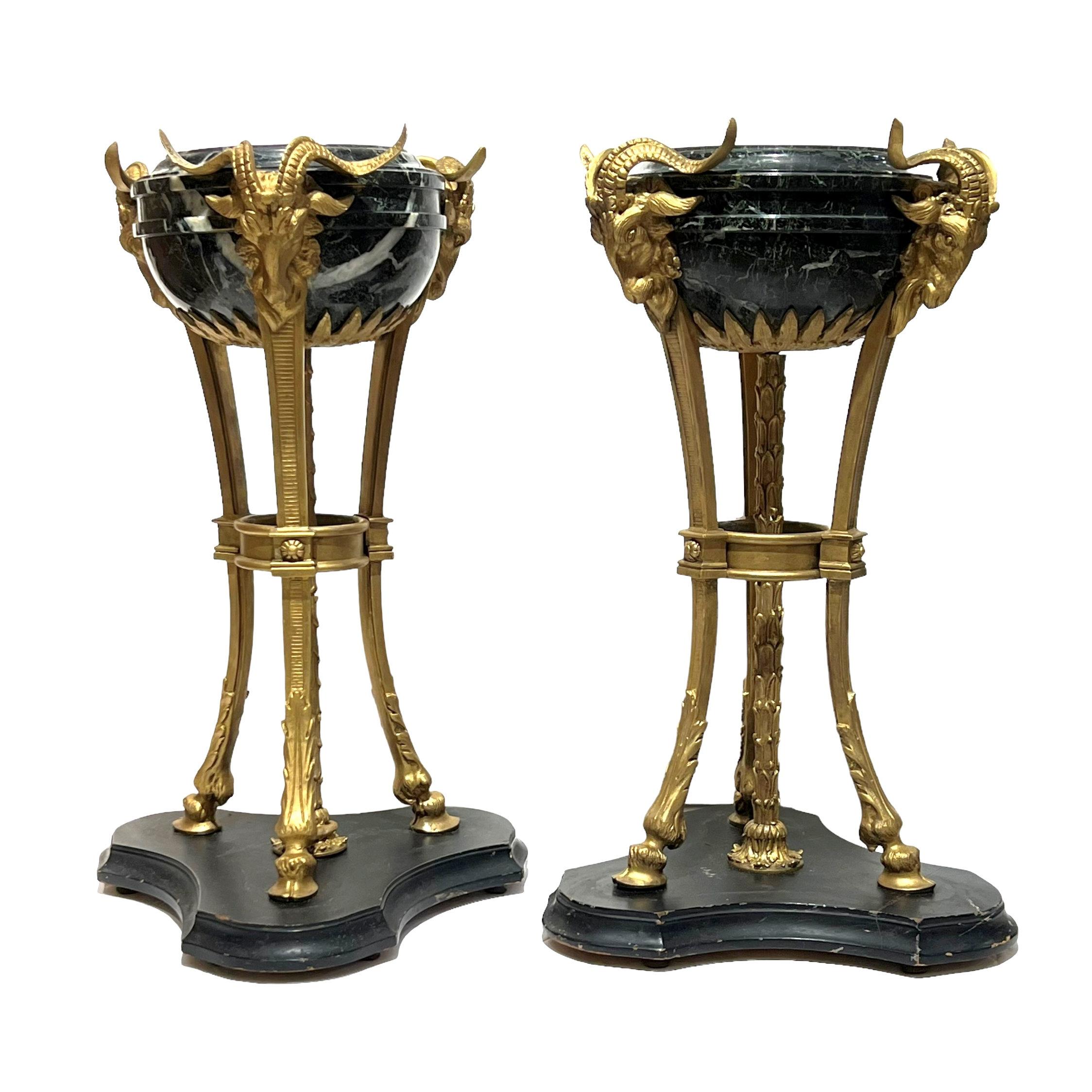 Pair French bronze and ebonized wooden neoclassical athenienne centerpieces in the Louis XVI style.