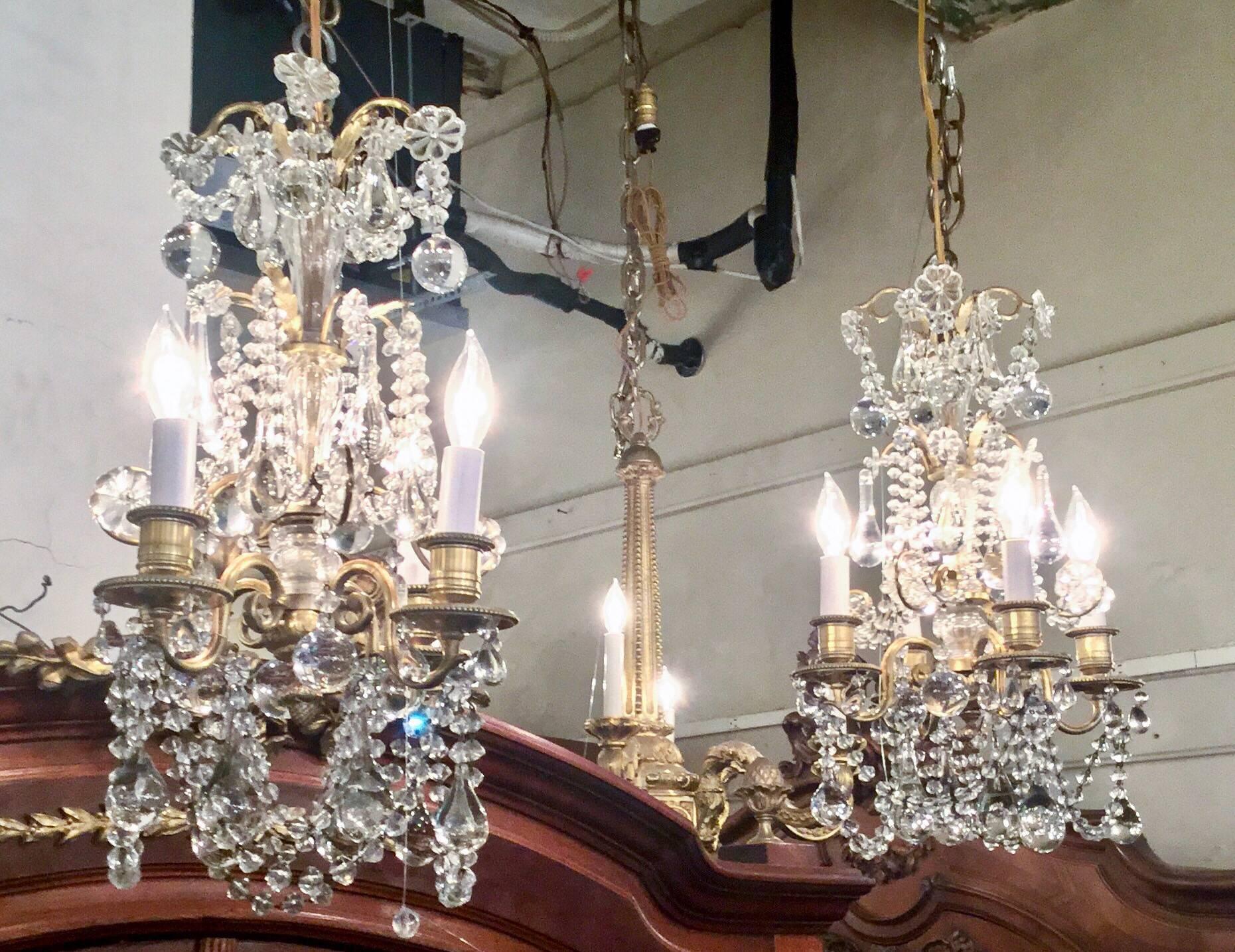 Pair of antique French bronze doré and Baccarat crystal chandeliers, circa 1880.