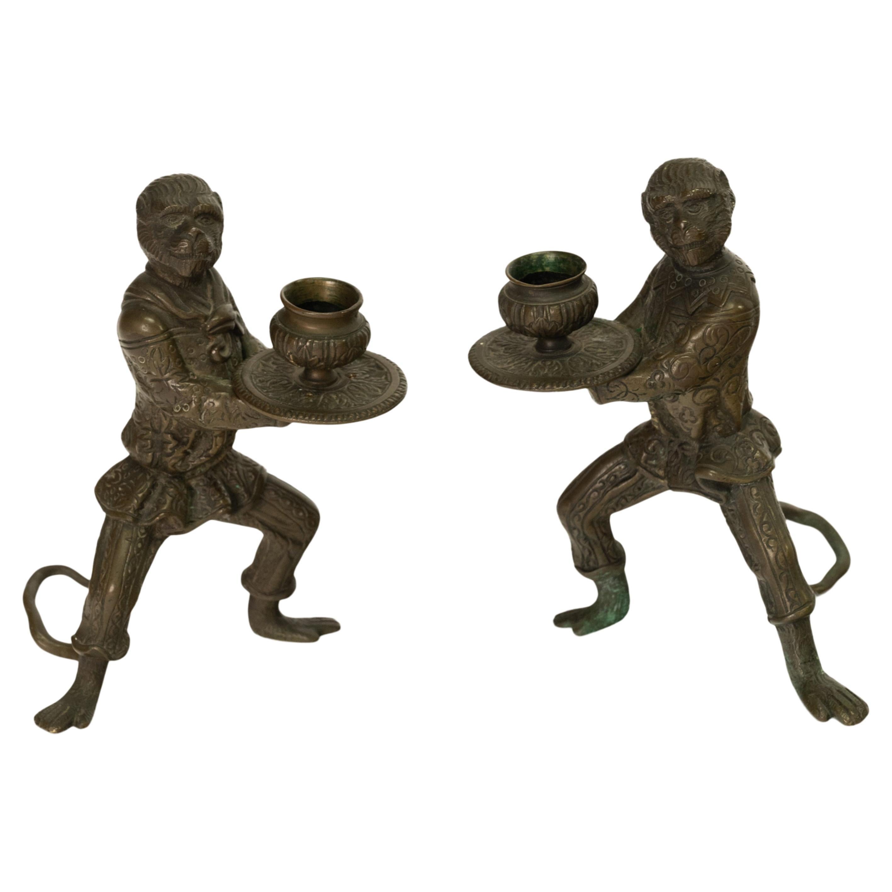 A good pair of antique French bronze monkey statuette candlesticks, circa 1900.
This pair of whimisical candlesticks are modeled as monkeys, with engraved Venetian outifts as worn by The 