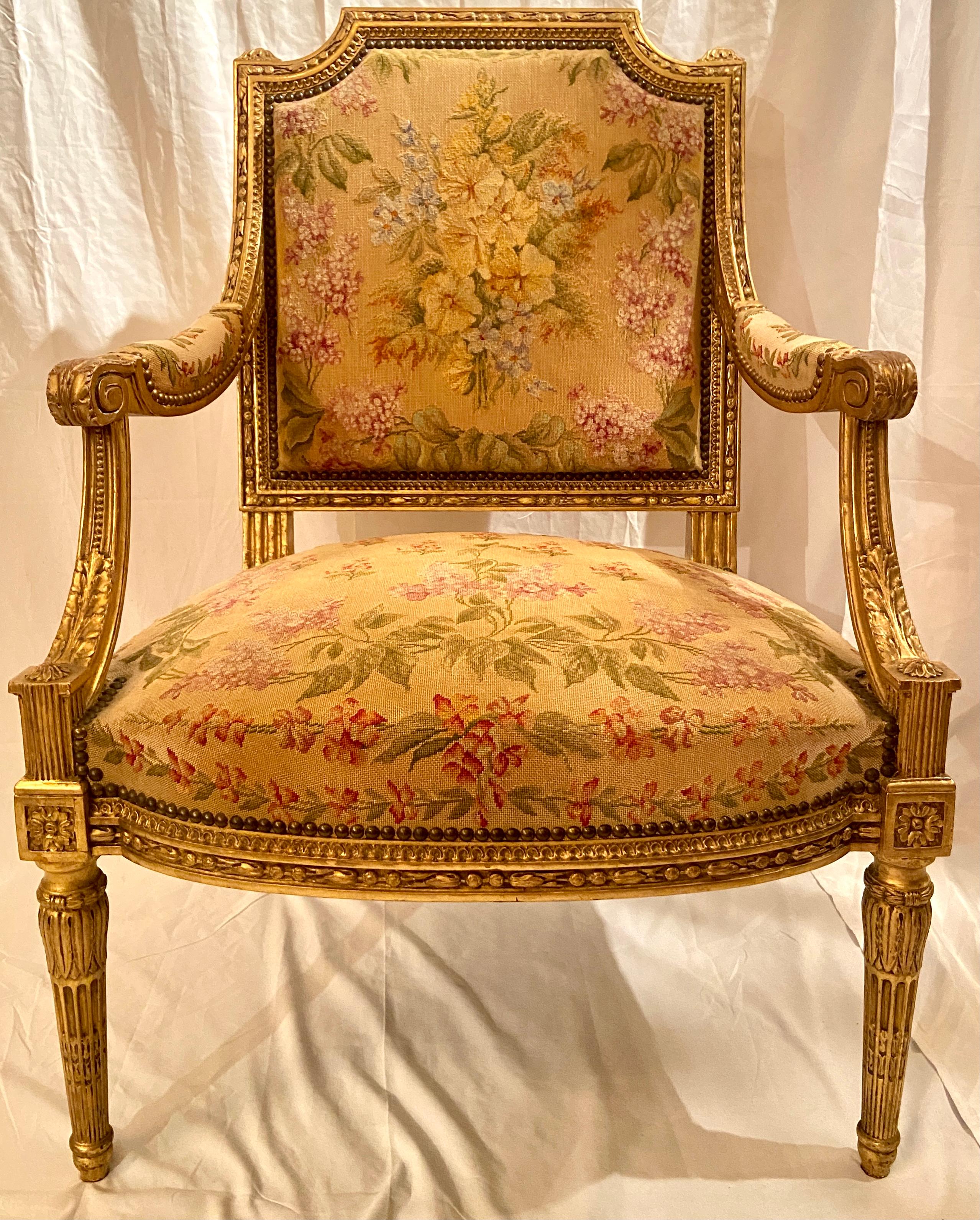 Pair antique French carved wood with gold leaf needlepoint armchairs, Circa 1880.
These armchairs are splendid and the needlepoint is in good condition. We have two pair of these chairs in our shop.