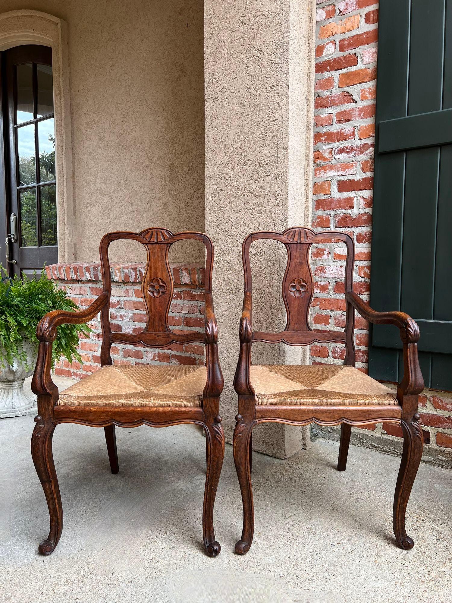 French Provincial PAIR Antique French Country Carved Oak Dining ARM Chair Rush Seat Set of 2 For Sale
