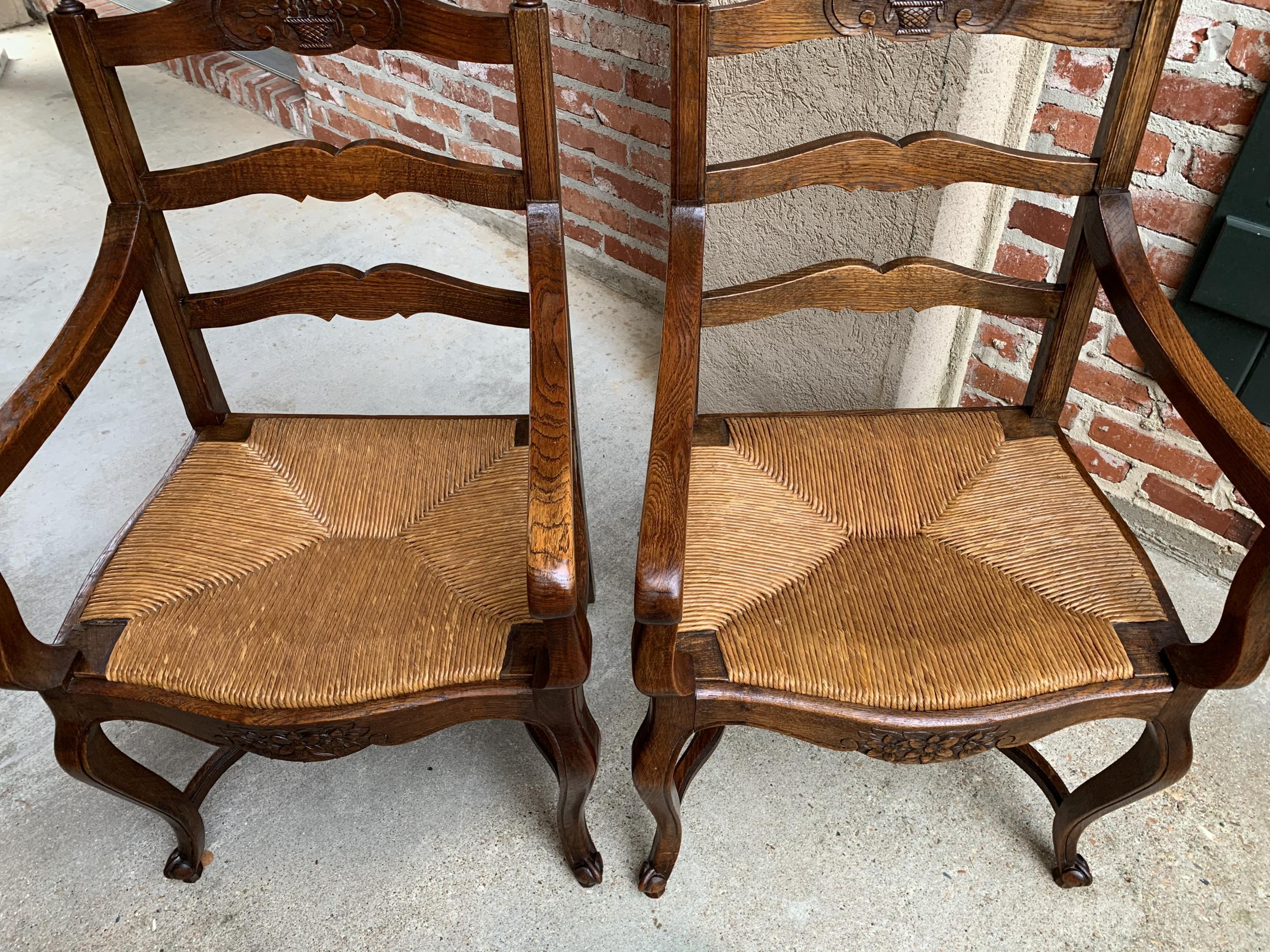 Early 20th Century Pair of Antique French Country Carved Oak Ladder Back Dining Armchair Rush Seat