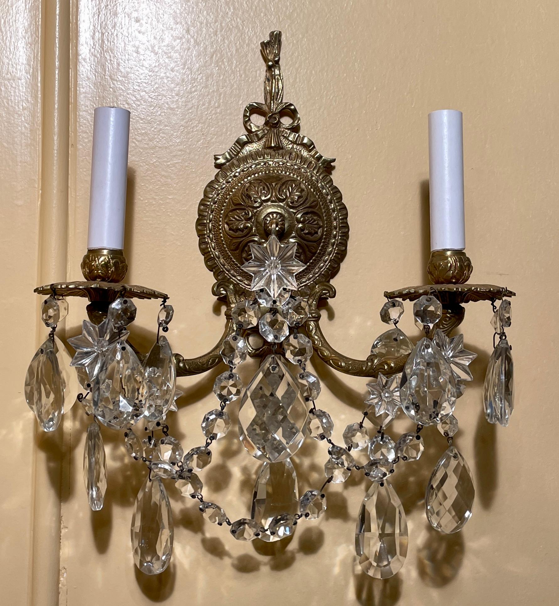 Pair antique French cut crystal and gold bronze 2 light sconces, circa 1900.