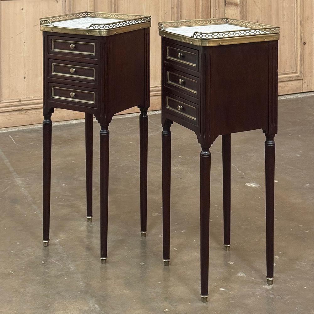 Pair Antique French Directoire Mahogany End Tables with Carrara Marble will make a delightful addition to your room, providing storage, display, perhaps a place for a lamp, convenient drawers, and tailored elegance that is truly timeless, and in a