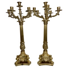 Paar antike französische Empire-Kandelaber aus Gold und Bronze