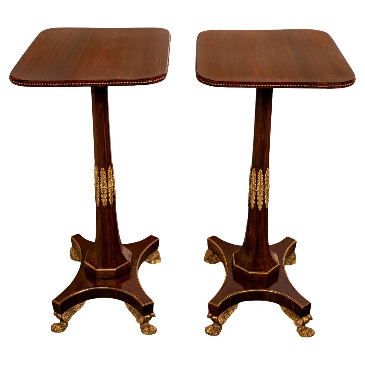 A fine & elegant pair of antique French Empire Napoleonic period rosewood and ormolu pedestal side/lamp tables, circa 1805.
Each table having a rectangular top with a beaded ormolu band to the edge, the tables having tapered octagonal pedestals
