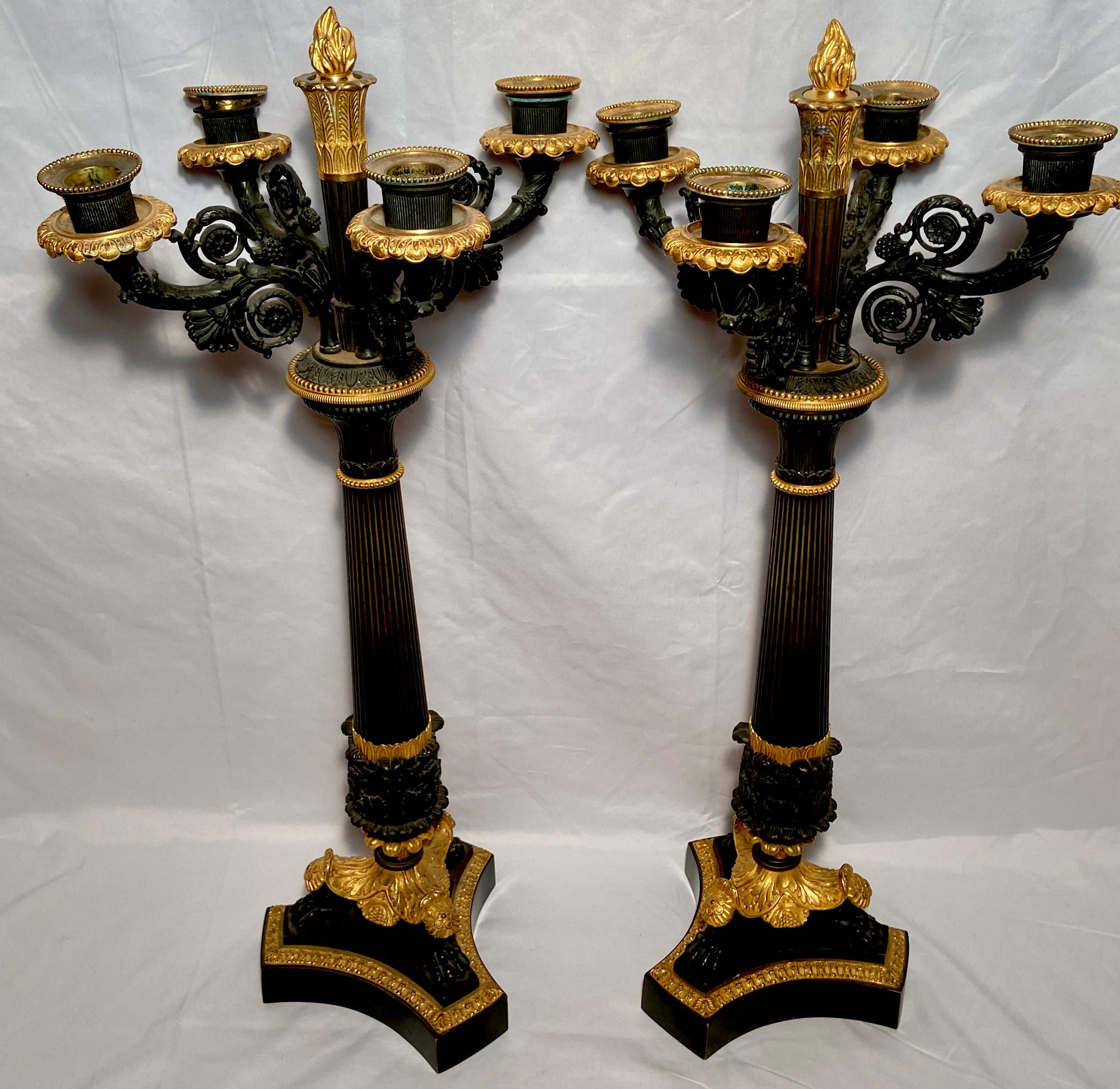 Pair antique French Empire patinated bronze & gold bronze candelabra, Circa 1860.
These handsome patinated candelabra would be a fine addition to any sideboard or large server. They have 4 arms.
