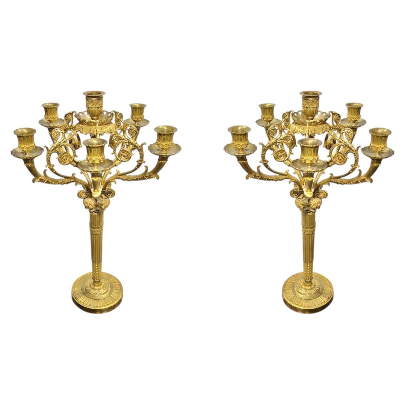 Paire de chandeliers anciens en bronze doré de style Empire français