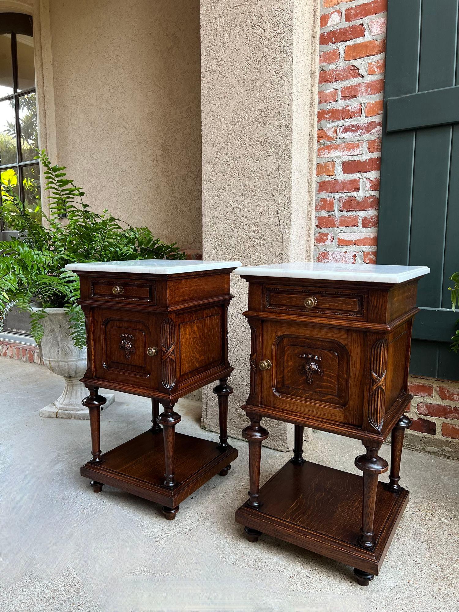 Pair Antique French End Table Cabinet White Marble Regency Carved Oak Nightstand.

This gorgeous PAIR of antique French tables or cabinets are a perfect compliment to the larger European antiques in your home, as they have all the details and style