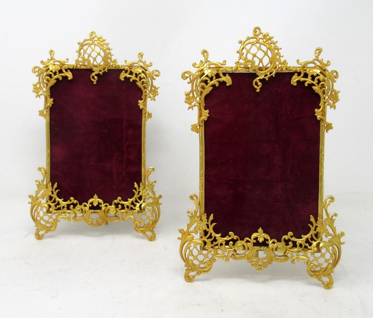 A stunning pair French Ormolu portrait standing photo frames of generous proportions, mid to late nineteenth century. 

The rectangular shaped highly decorative ormolu leafy frame enclosing a single portrait shape photo inset space surmounted with