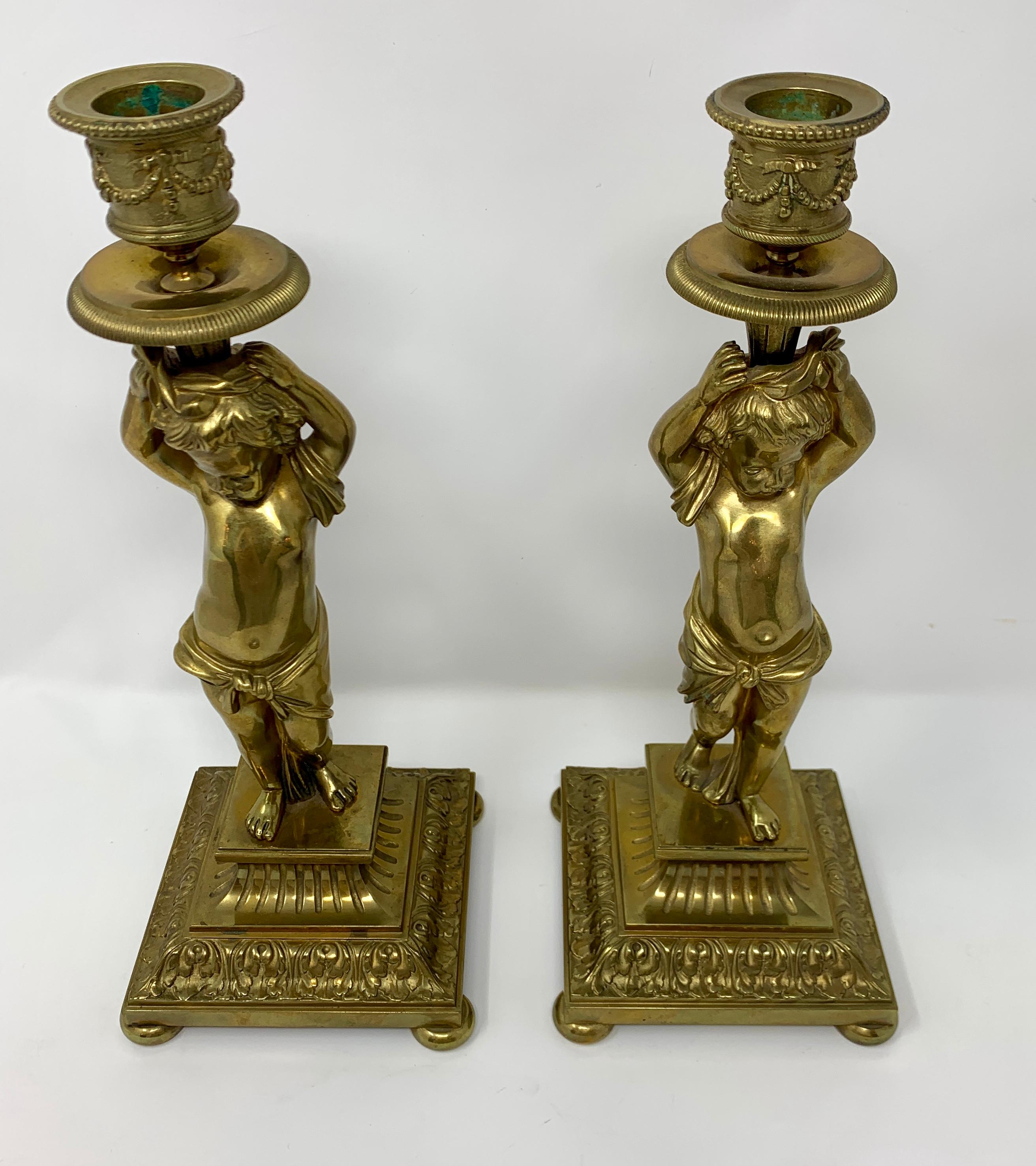 A charming pair of cupid candlesticks.