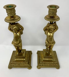 Pair of Antique French Gold Bronze Cupid Candlesticks