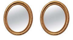 Pair Antique French Louis Philippe Gold Leaf Oval Mirrors, Circa 1890.