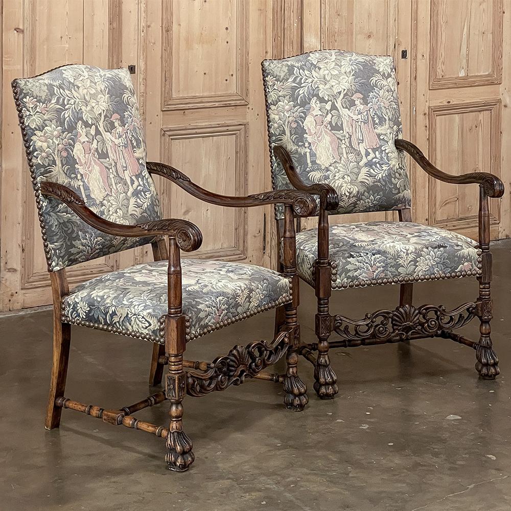 Pair Antique French Louis XIII Armchairs with Tapestry Upholstery will make a handsome addition to any room! Tall, fully upholstered seatbacks combine with a generous seat to provide excellent comfort, with the luxurious tapestry upholstery in very