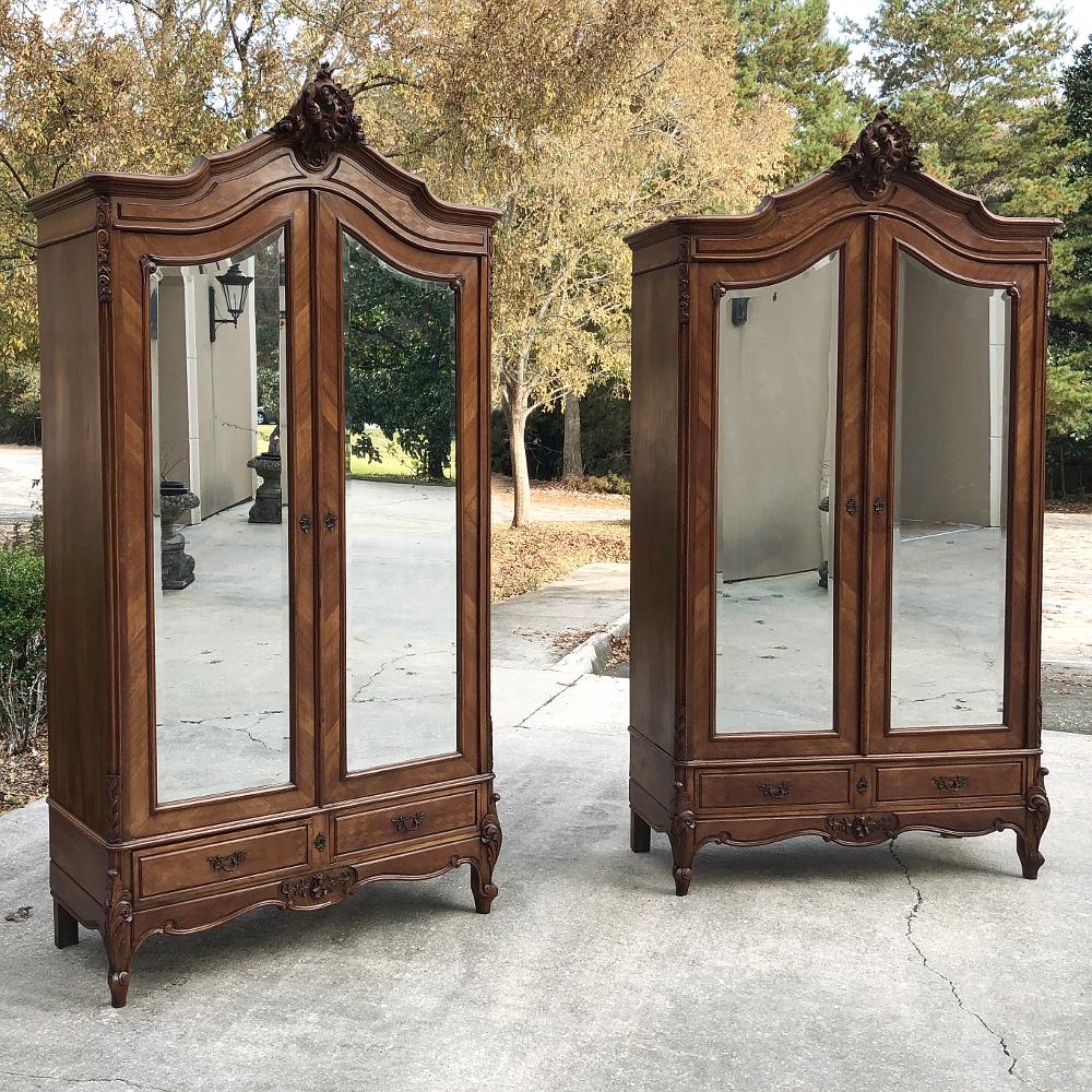Pair of antique French Louis XV mahogany armoires are a rare treat indeed. This pair brings the 