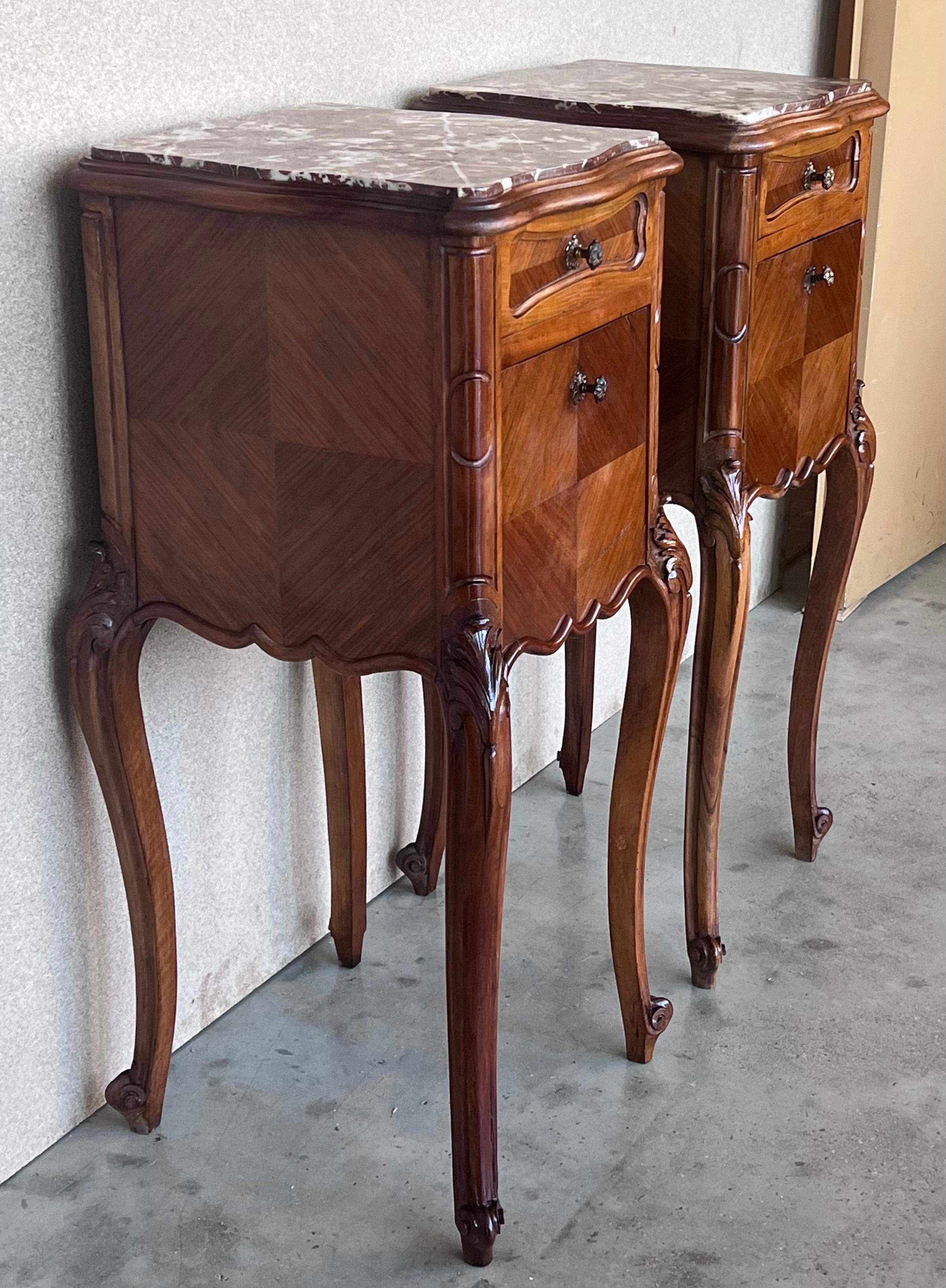 Pair Antique French Louis XV marble top nightstands will make great companions in any room! 
Handcrafted from solid oak to last for generations, each has been adorned with carved detail on the four boldly scrolled cabriole legs embellished with