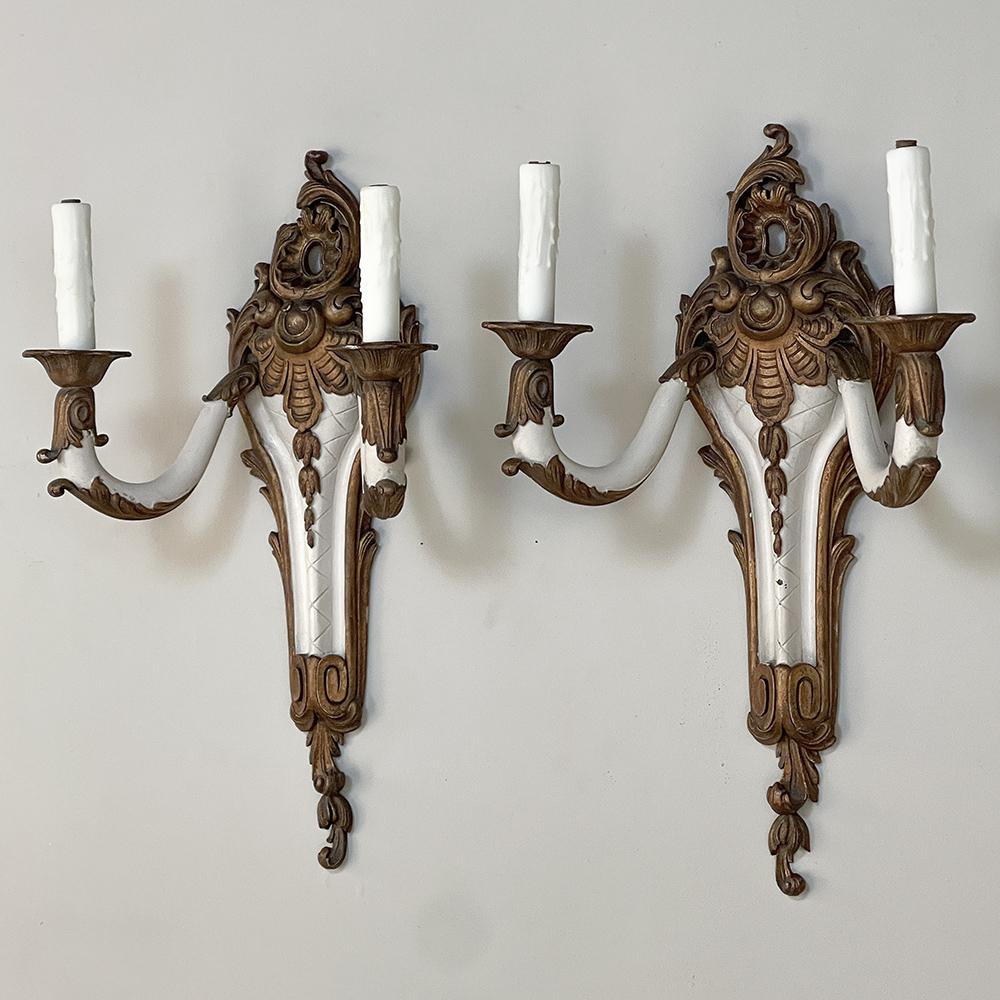 Pair Antique French Louis XV Painted Wall Sconces are the perfect choice to provide timeless elegance to any room!  Carved from solid wood by master sculptors, each features the classic asymmetrical rococo style shell on top, each 
