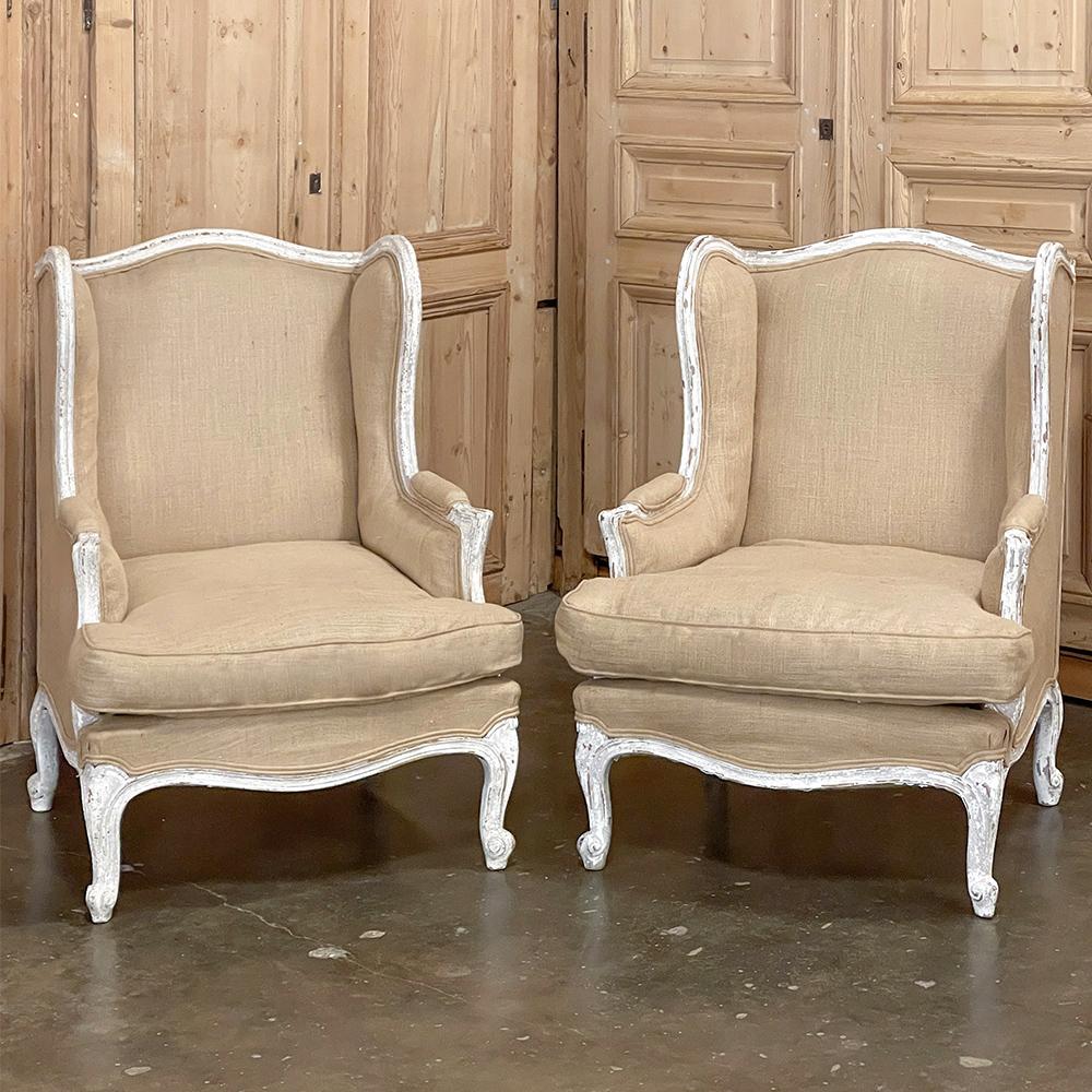 Pair Antique French Louis XV Painted Wingback Armchairs ~ Bergeres feature graceful naturalistic lines, a beautifully patinaed, distressed painted finish, and linen upholstery for a soft, comfortable effect!  The tailored lines of this pair combined
