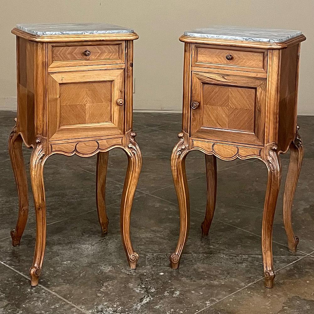 Pair Antique French Louis XV walnut marble top nightstands are the perfect answer for providing style, convenience, and tailored elegance to any room, especially as bedside companions, although they make excellent seating group accompaniments thanks