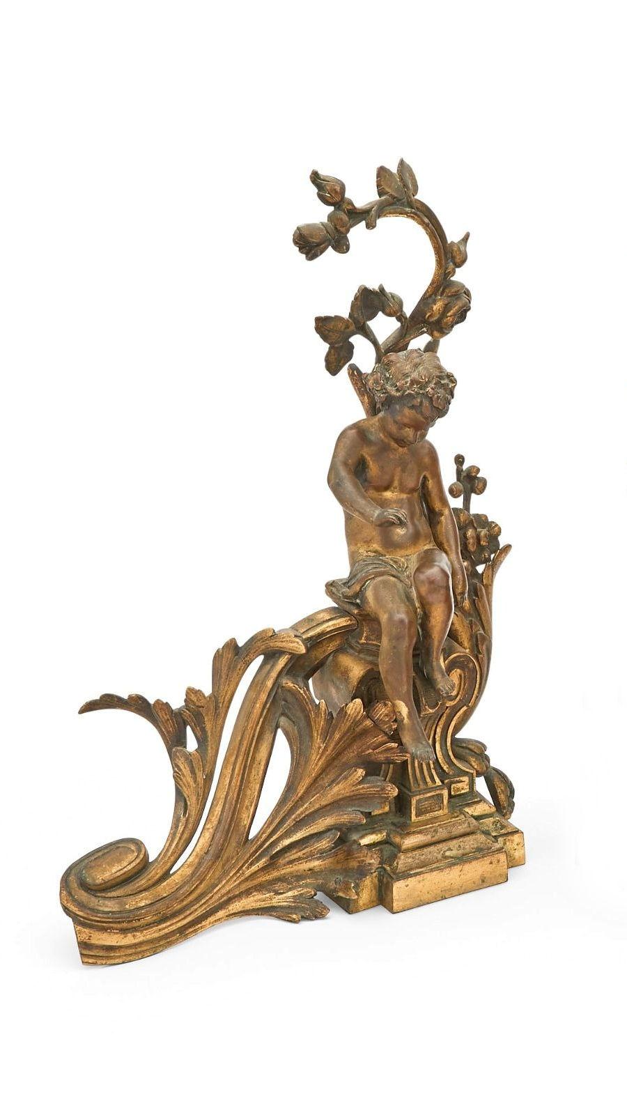 Pair of French 19th century finely cast and gilt bronze andirons in the neoclassical Louis XV/ XVI style depicting seated cherubs.