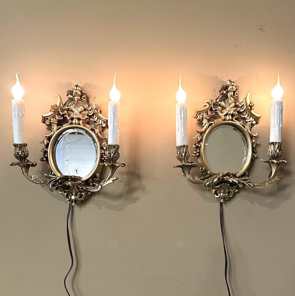 Pair Antique French Louis XVI Bronze Wall Sconces are cast in solid bronze, and each has achieved the beginnings of a lovely patina.  The detail is pervasive and extensive, with florals, foliates, grape clusters and shells.  Each realistic