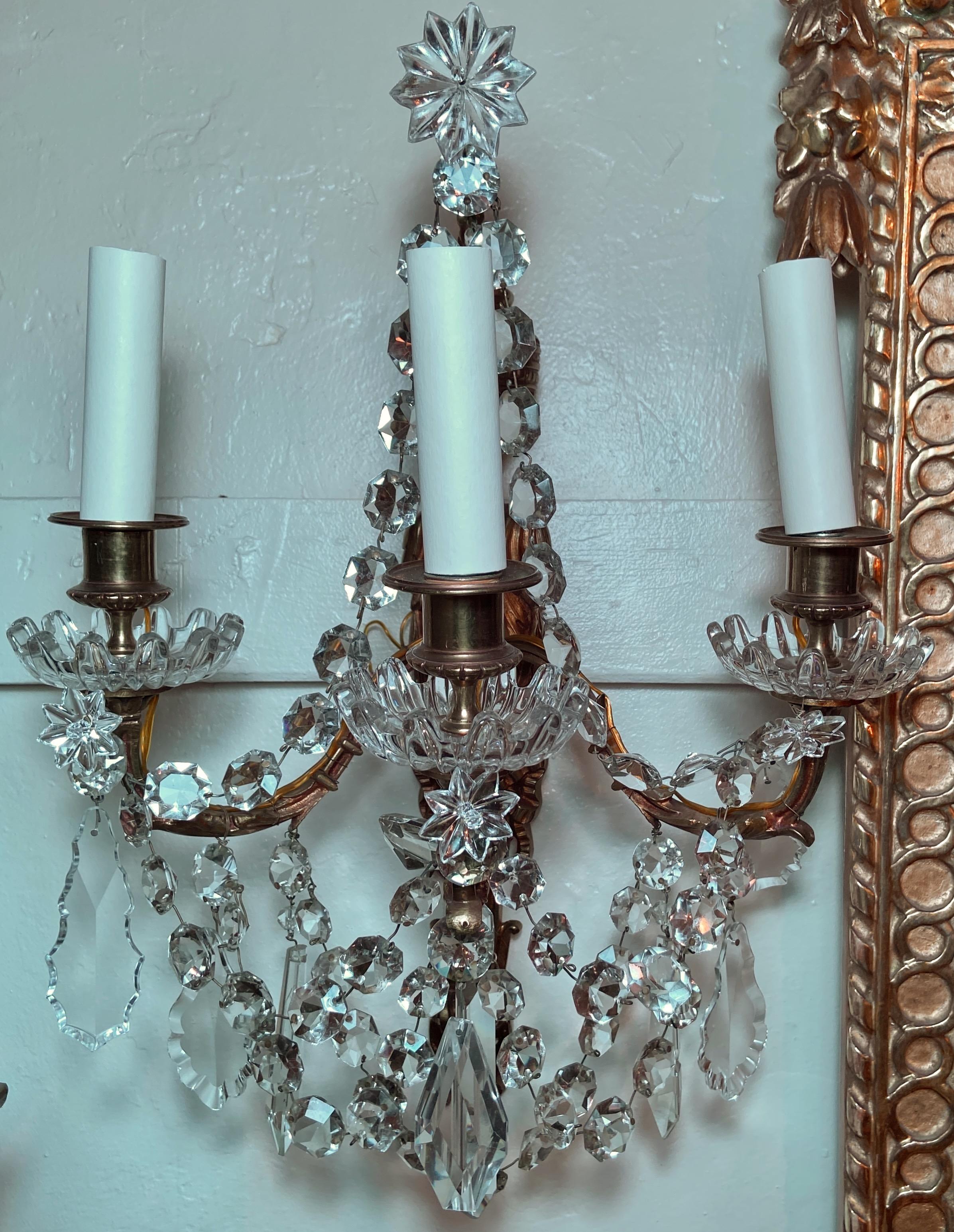 Pair antique French Louis XVI gold bronze and crystal wall sconces, circa 1890.