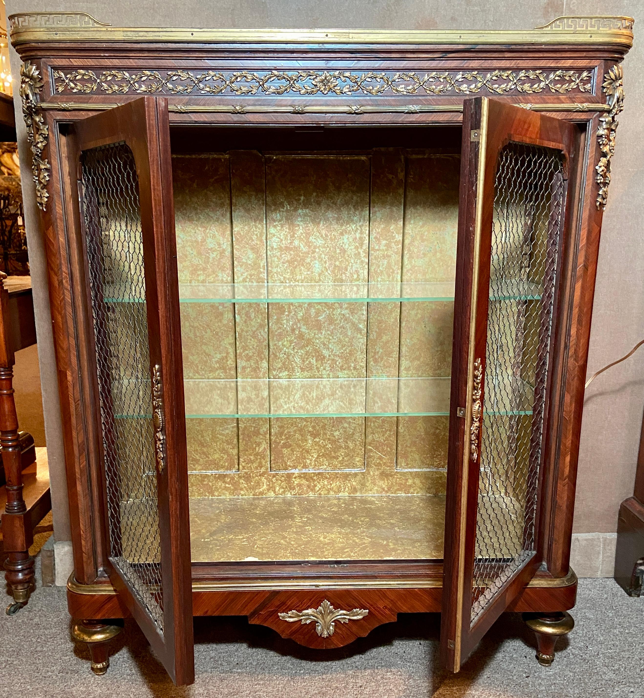 Pair Antique French Louis XVI Marble Top Cabinets, Circa 1890.
Very pretty cabinets with interior glass shelves, a galleried marble top and wire mesh fronts on doors.