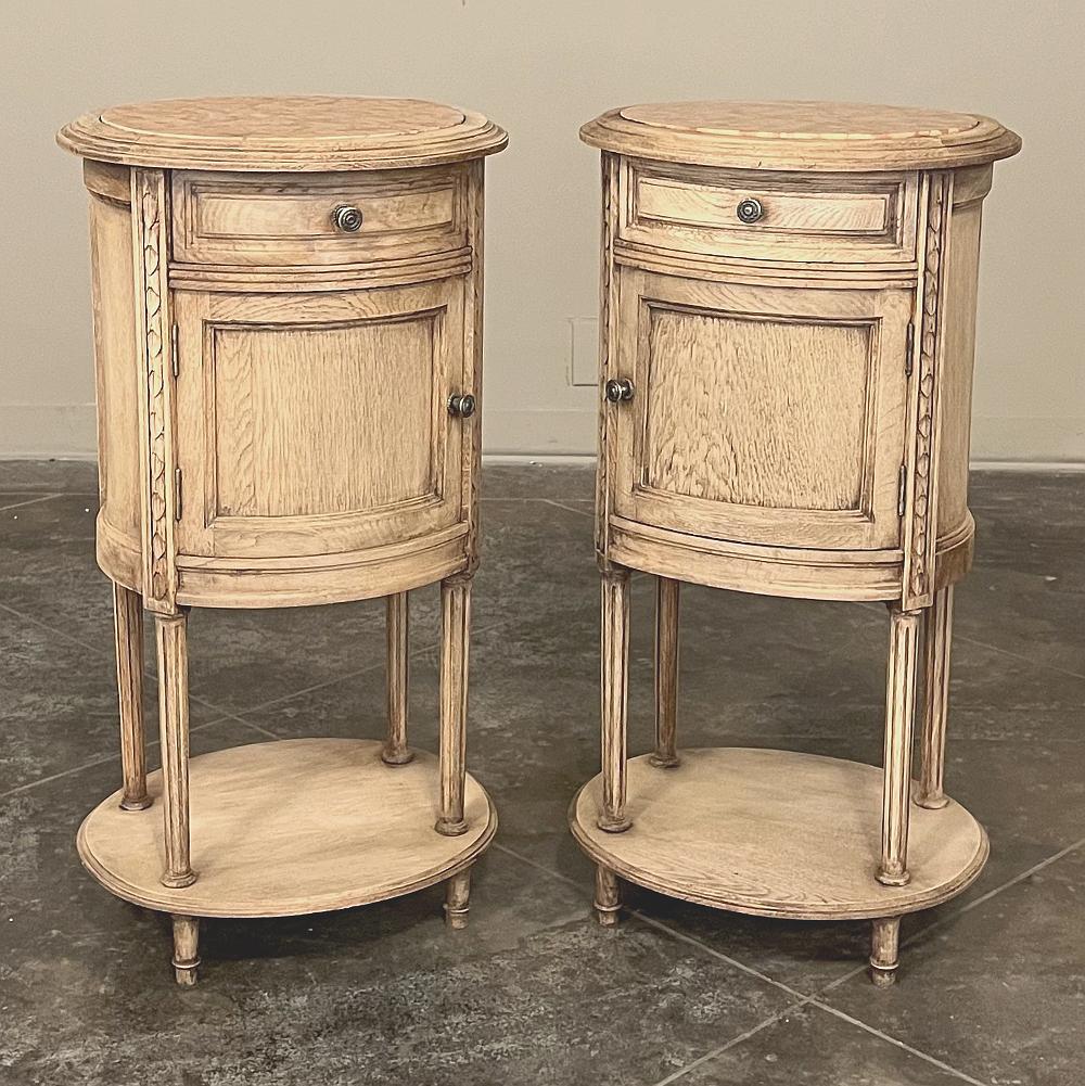 Pair Antique French Louis XVI oval marble top nightstands are the ideal choice for symmetry as bedside companions or for your favorite seating group! Oval in shape and finished all around, they're perfect for placement anywhere in the room. On top,