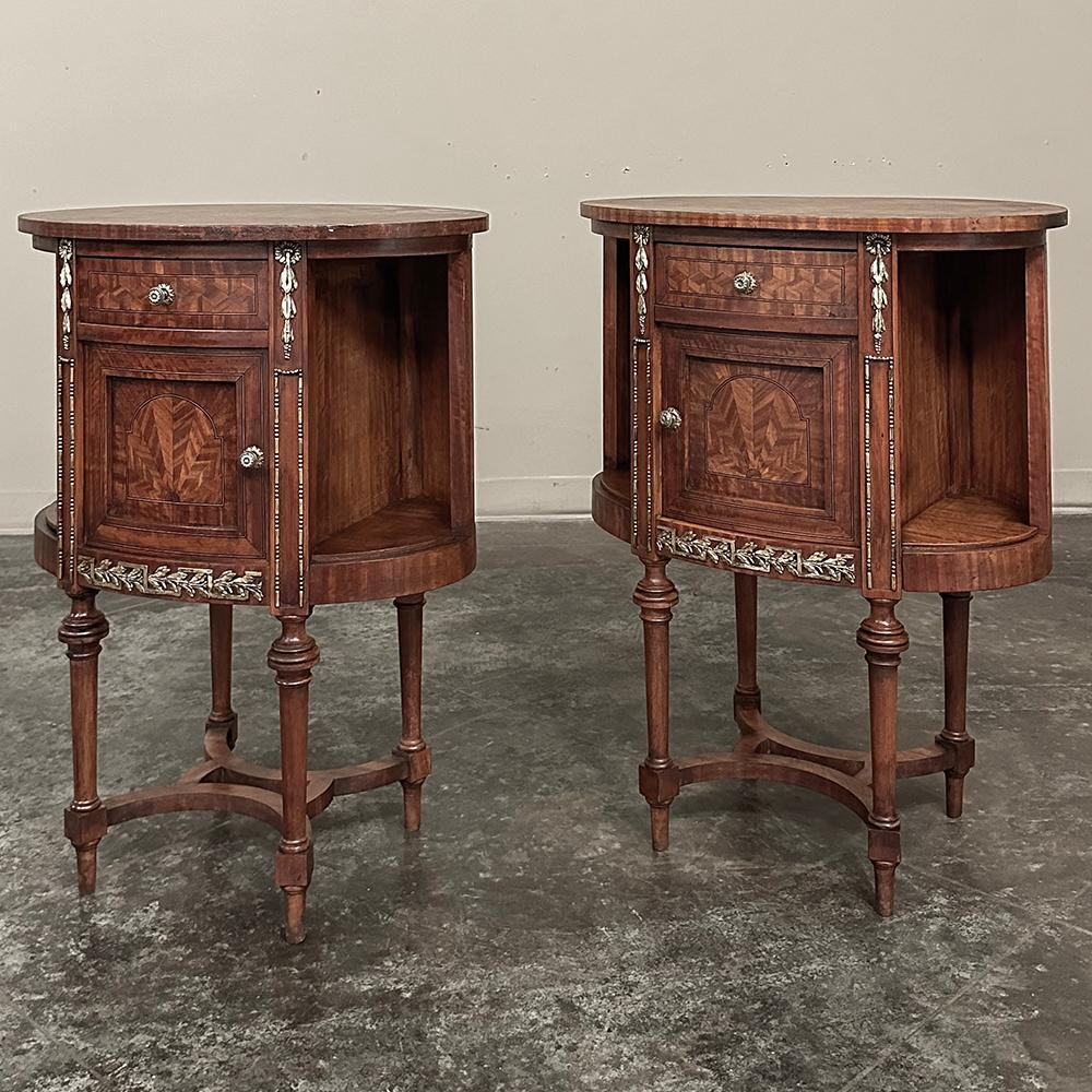 This PAIR of Antique French Louis XVI Oval Marquetry Nightstands ~ End Tables is truly a fantastic find!  Providing a larger surface than typical French nightstands yet with an oval form that presents absolutely no sharp corners anywhere, they are