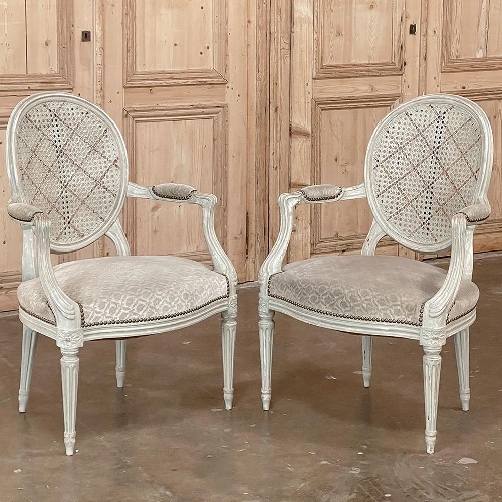 20th Century Pair Antique French Louis XVI Painted Armchairs with Cane and Fabric For Sale