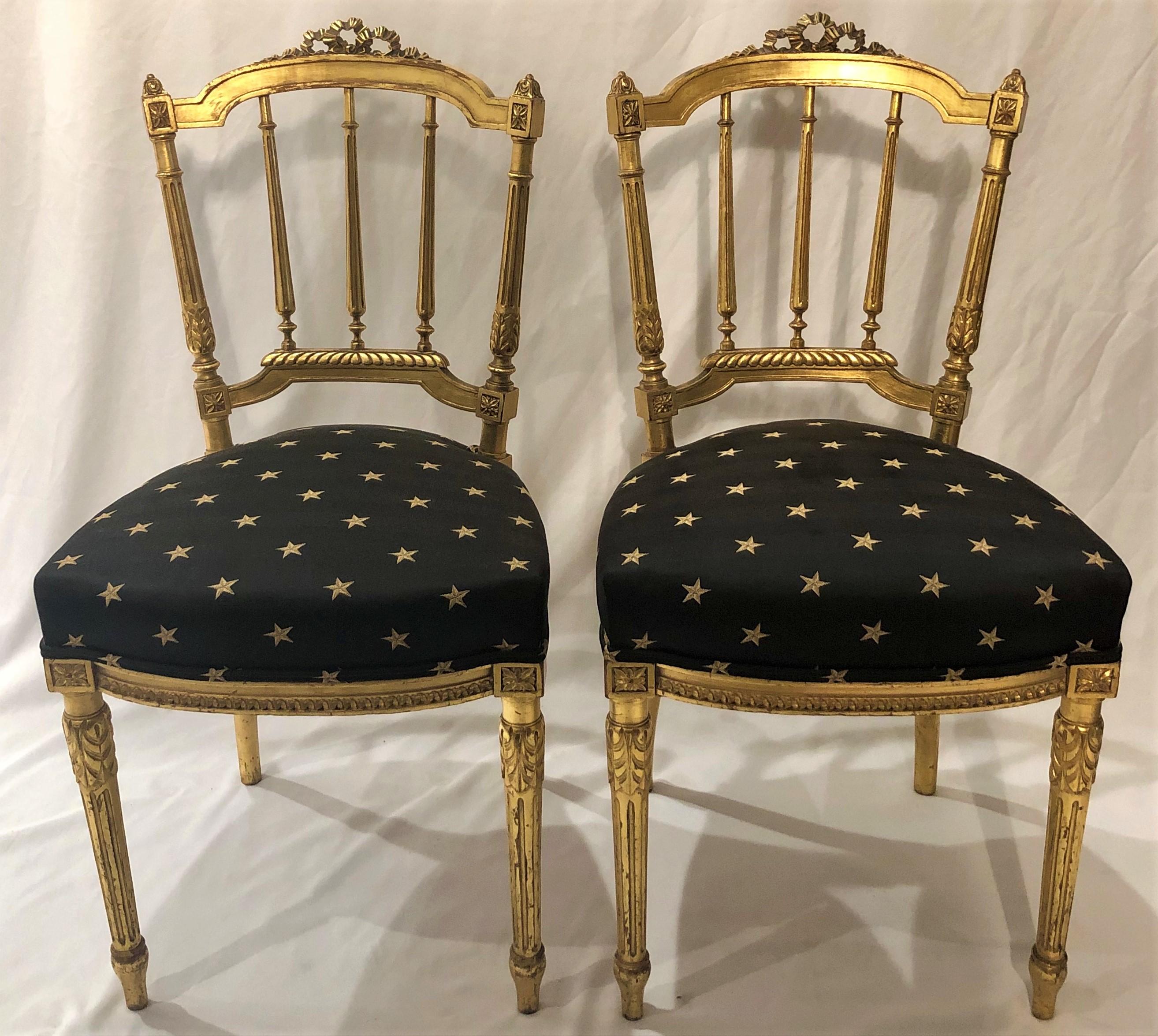 Pair of antique French Louis XVI style gold side chairs, circa 1880.