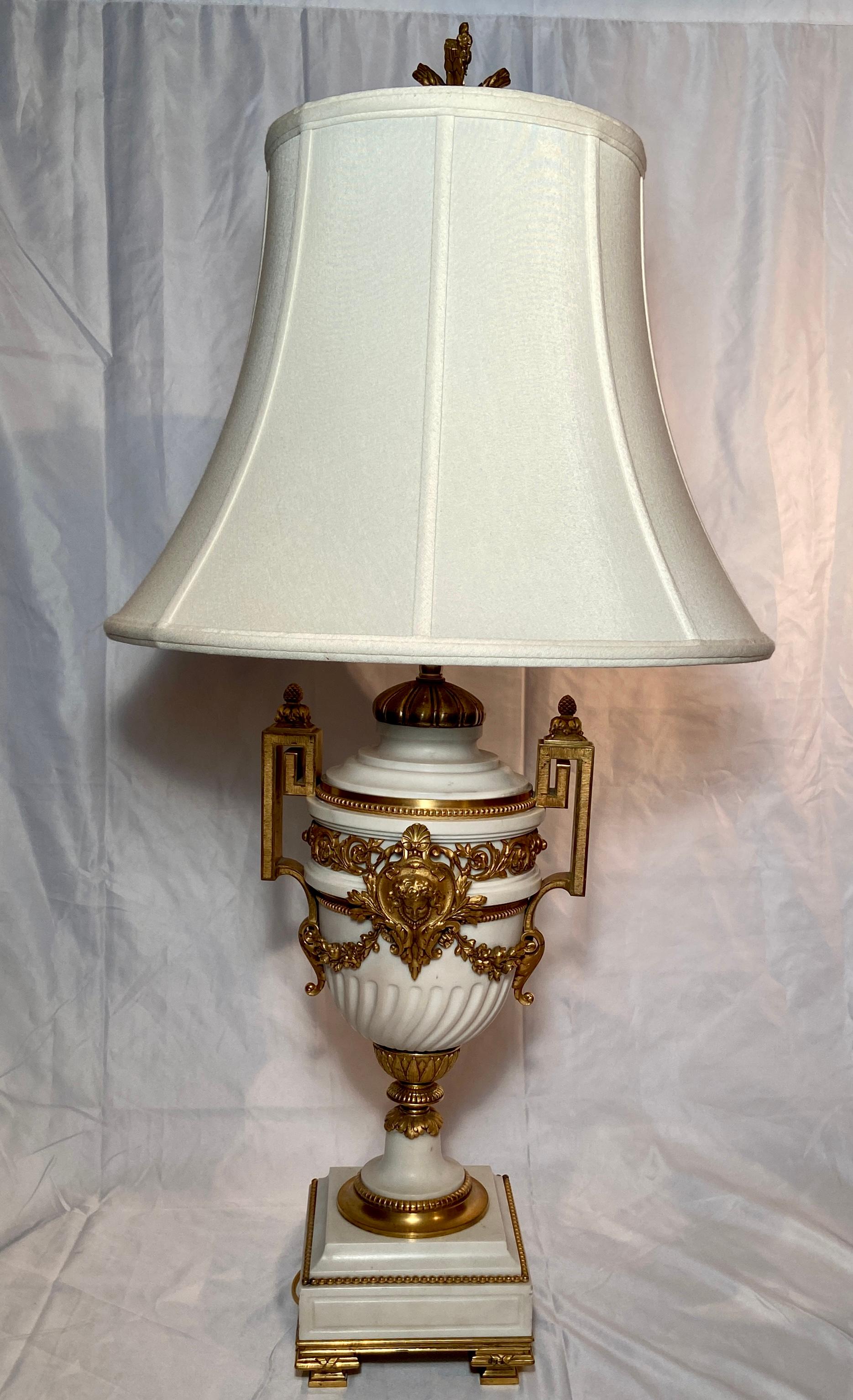 Pair antique French Louis XVI Style white marble and ormolu urn lamps, Circa 1840-1860.