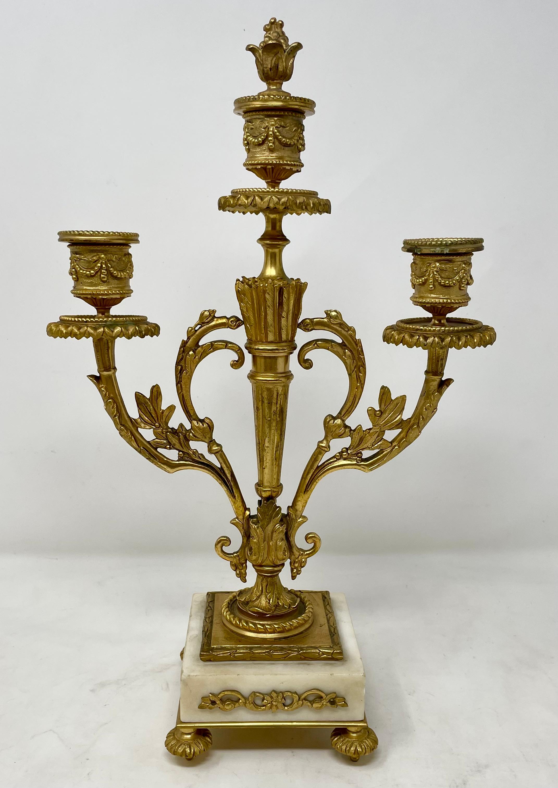 Pair antique French white marble and gold bronze candlesticks, circa 1880's.