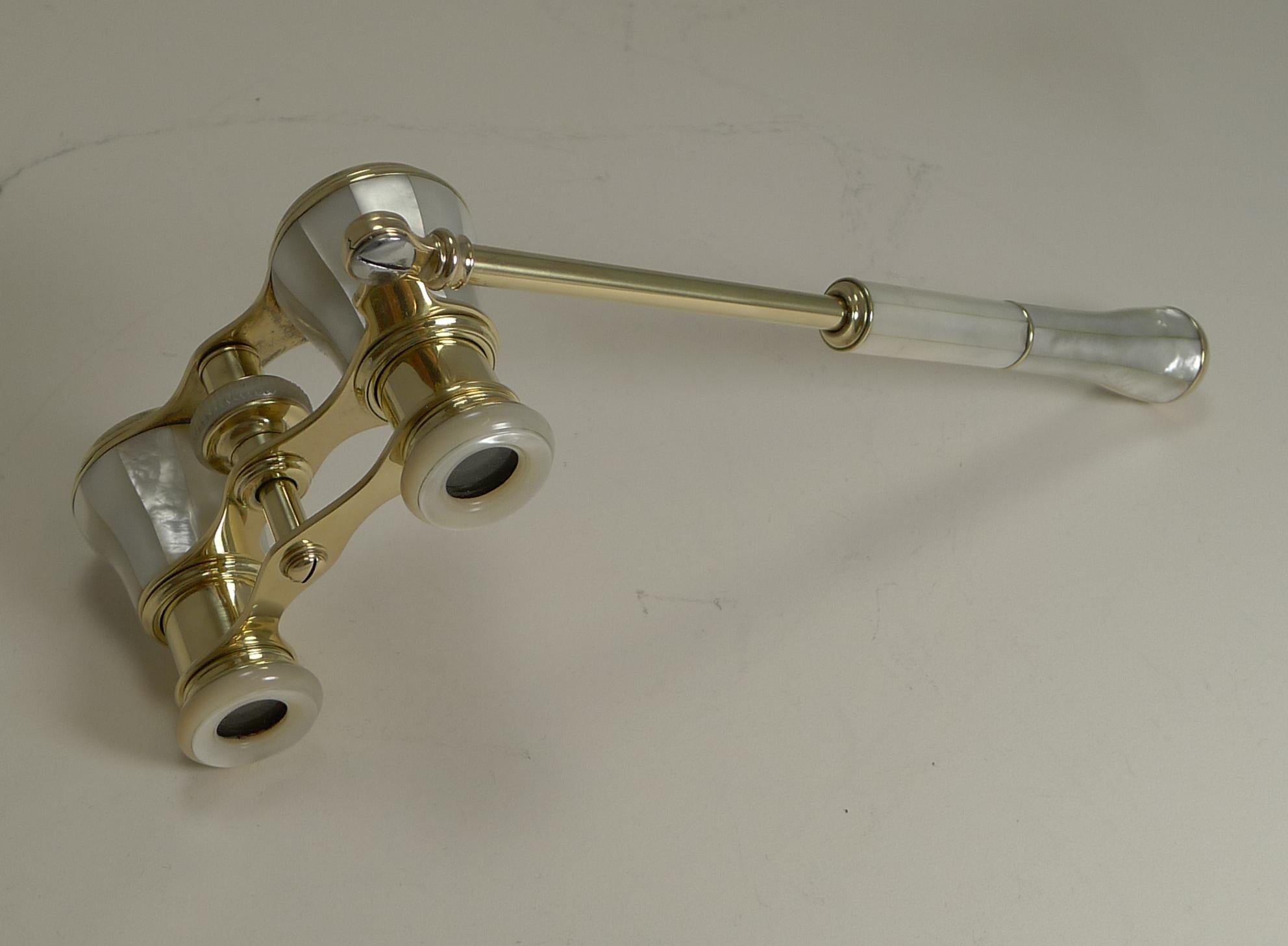 A splendid pair of late Victorian Opera / Theatre glasses professionally re-polished to gleam, making them as good as they would have looked over 100 years ago.

This is a pair with a telescopic lorgnette handle. All is wrapped in wonderful Mother