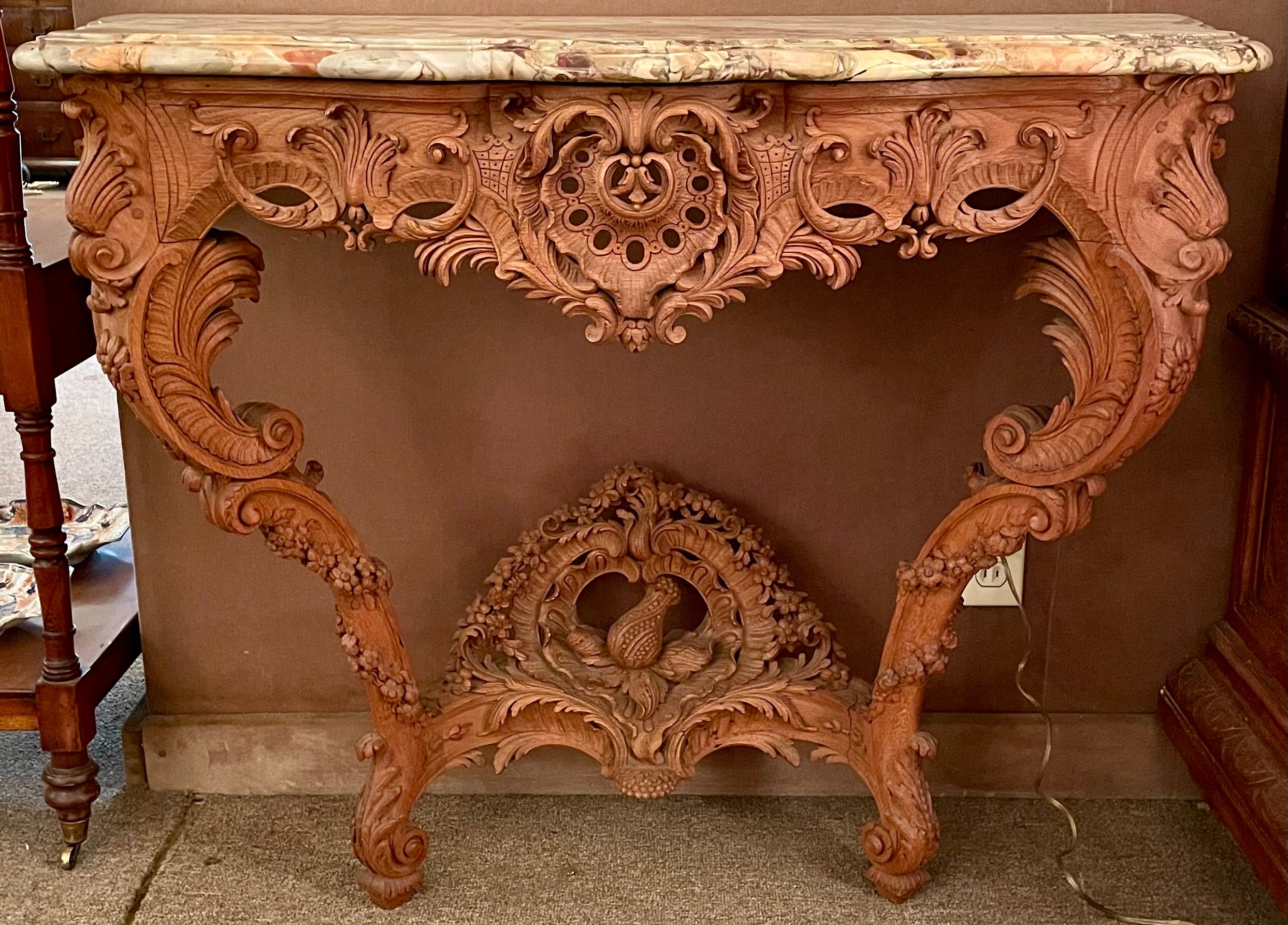 Pair Antique French Régence Carved Oak Marble Top Console Tables, Circa 1880.
Each console has a coordinating but slightly different marble top. 