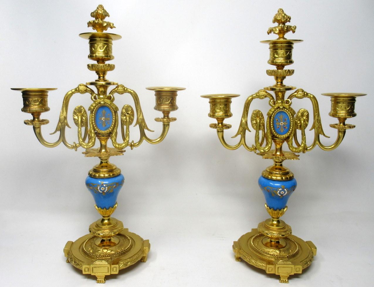 A very stylish pair of twin light gilt heavy gauge ormolu table or mantel (fireplace) candelabra in French Sevres style, last quarter of the 19th century, of French origin. 

Each with central Sevres style porcelain Urn with gilt decoration and