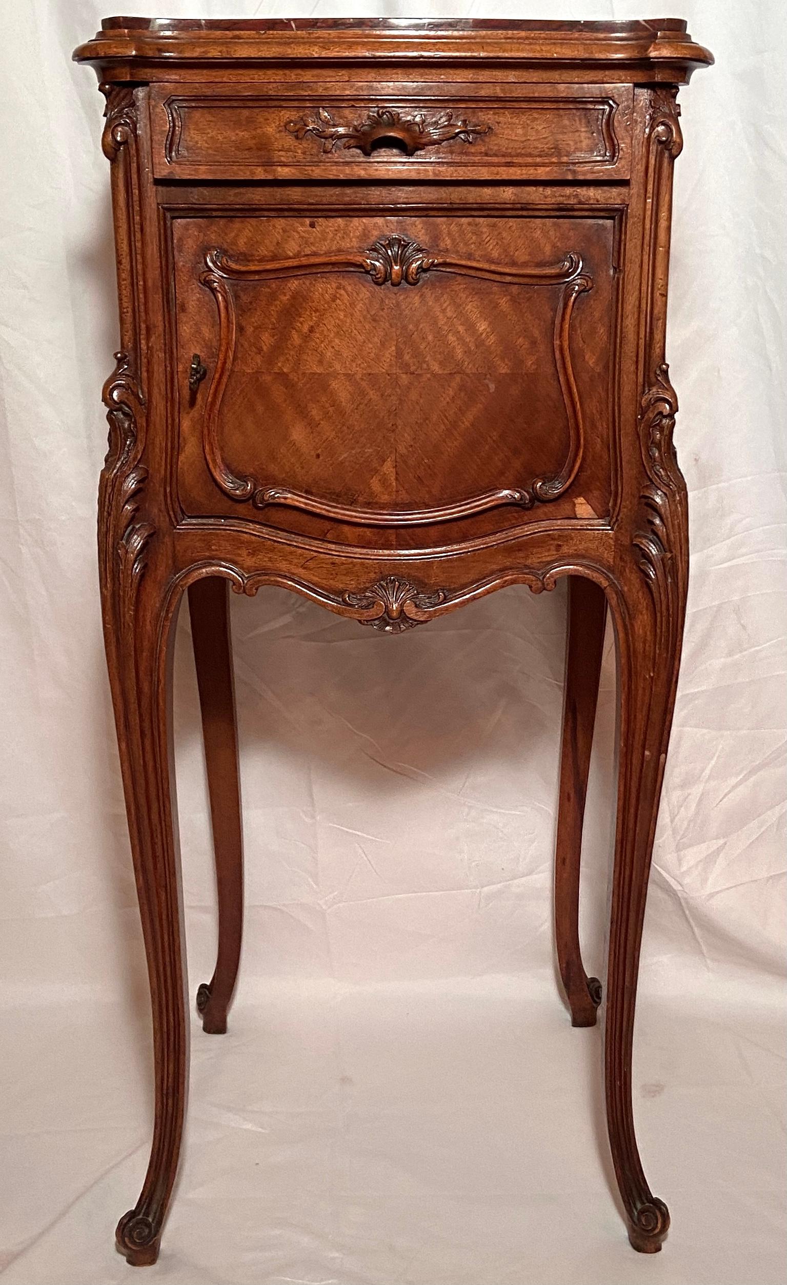 Pair antique french rosewood and rouge marble-top bedside tables, Circa 1870. Listed as bedside tables, this pair of tables could also flank a sofa, or be placed separately in the home: options are endless!