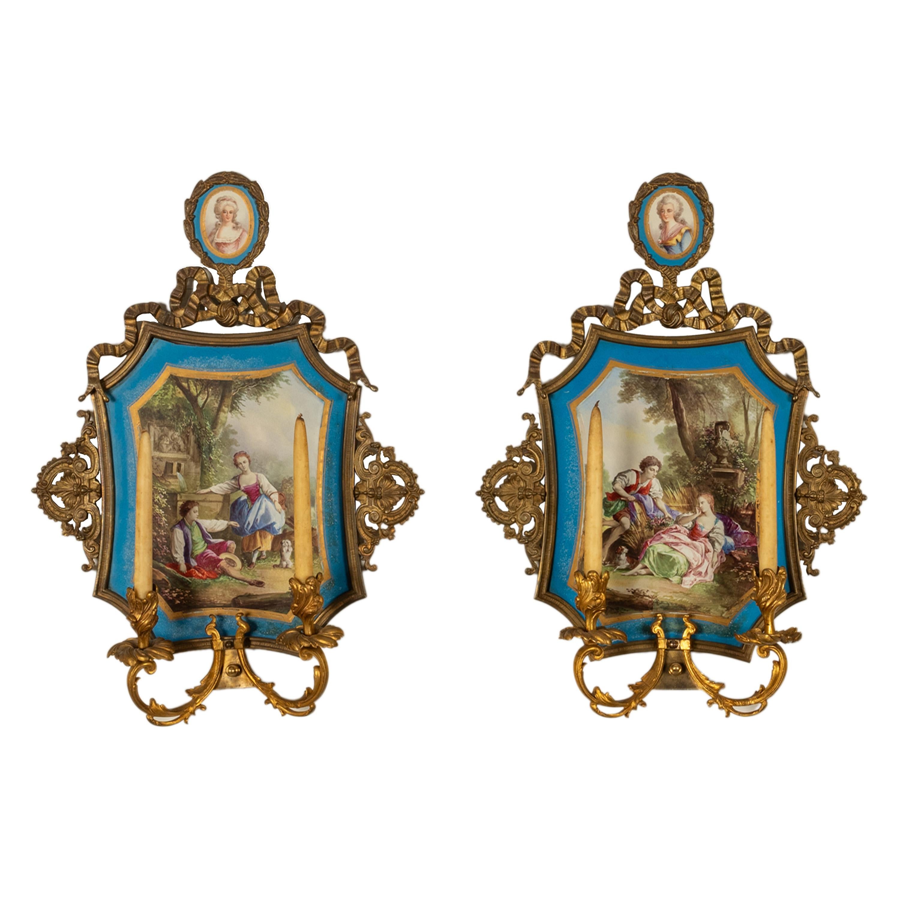 A fine & large pair of antique French Sevres porcelain ormolu mounted candle wall sconce lights, mounted with portrait miniatures, circa 1880.
The top of each sconce is inset with a Sevres porcelain portrait miniature of  Princess Elizabeth the