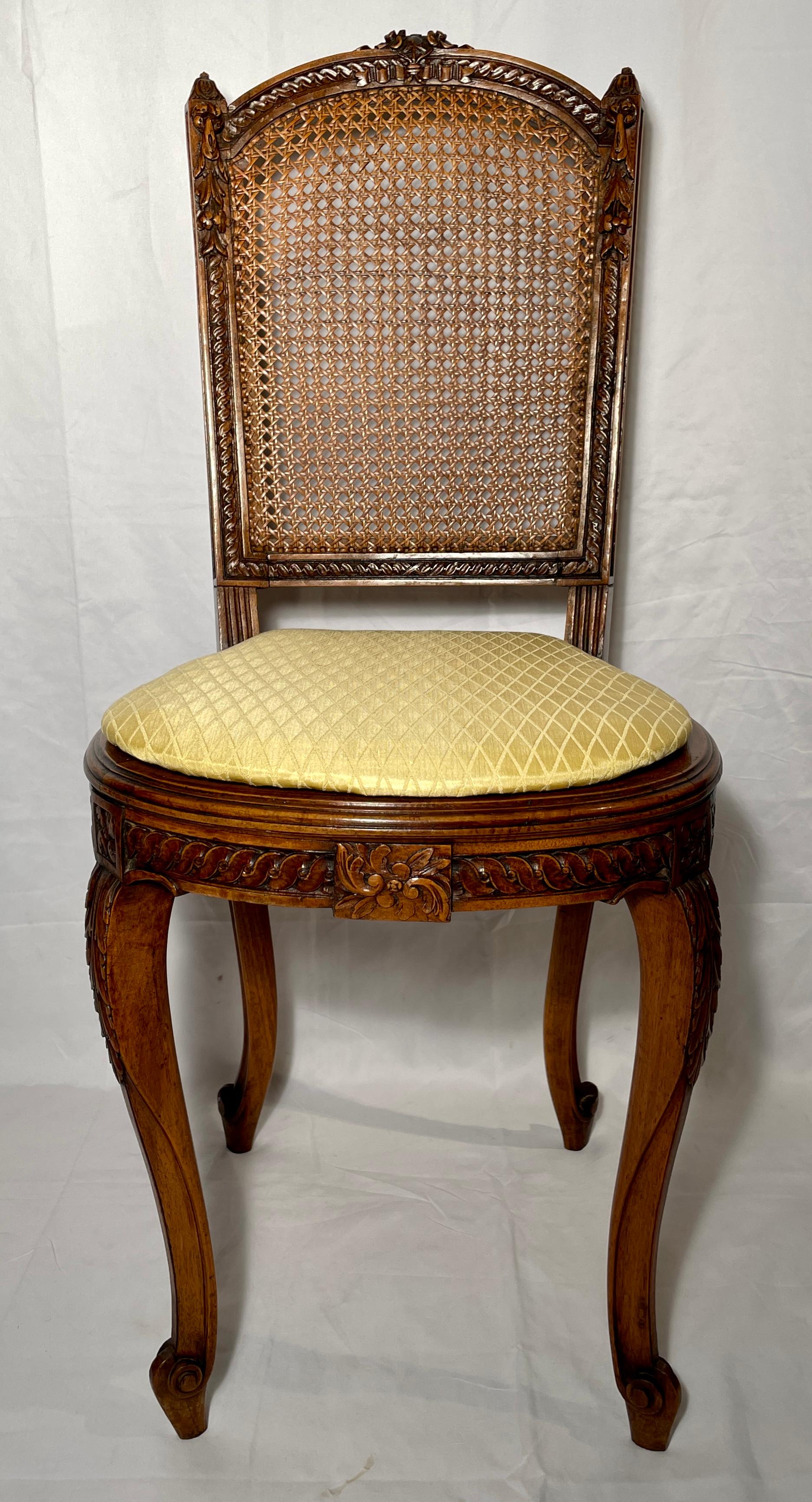 Pair Antique French walnut cane back side chairs, circa 1880.
