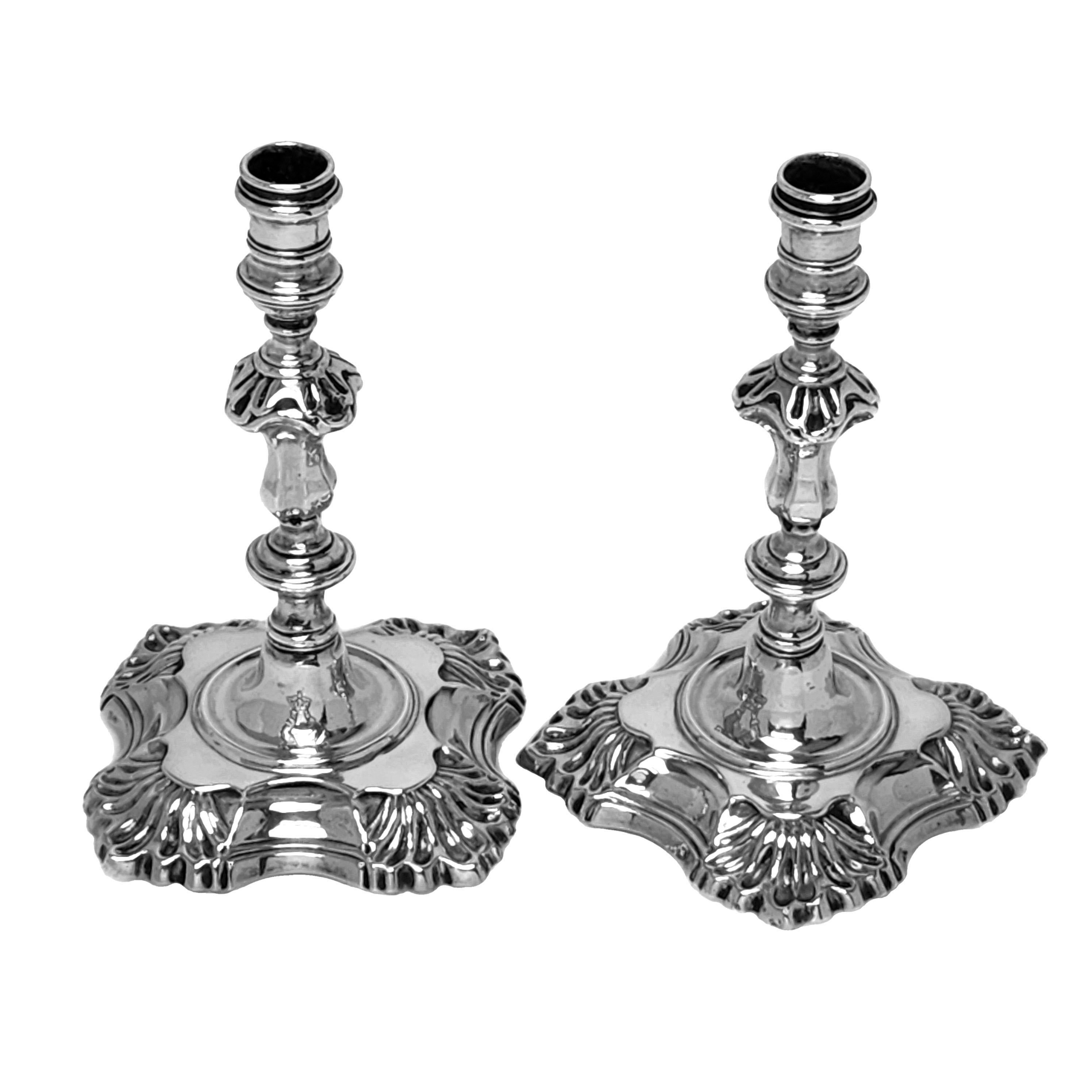 A pair of Antique George II sterling Silver Tapersticks. These early Georgian cast silver Candlesticks have a classic shell quatrefoil design with knopped columns.

Made in London, England in 1744 by James Gould.

Approx. Weight - 338g /