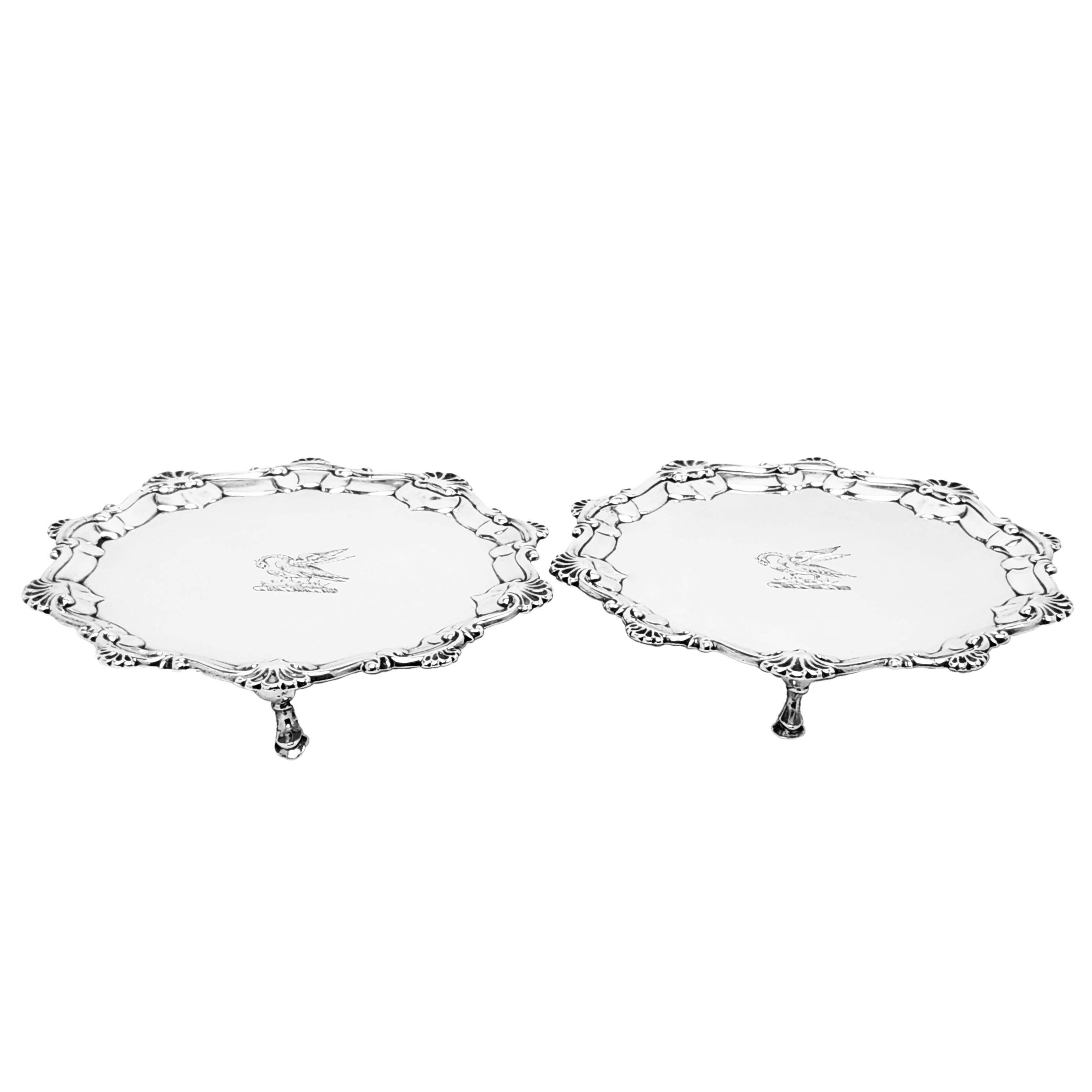 A pair of Antique George III Sterling Silver Salves each with a shaped shell border and with a crest engraved on the centre. Each Georgian Salver stands on 2 hoof feet.

Made in London in 1767 by John Cormick.

Approx. Total Weight - 406g /