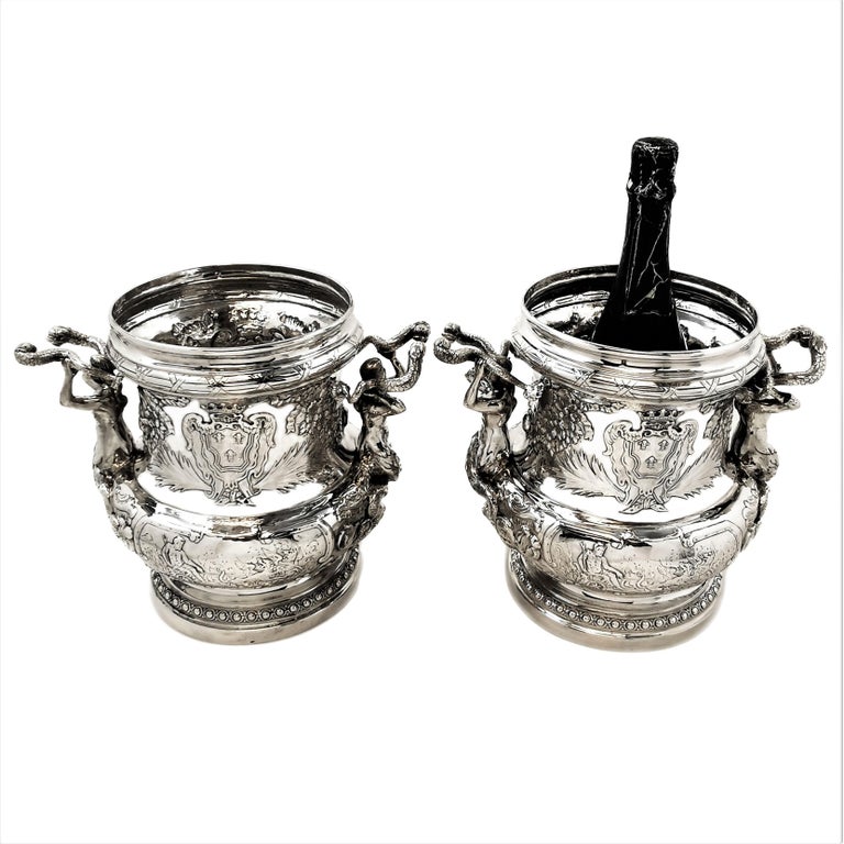 A pair of truly magnificent Antique Solid Silver Wine Coolers / Champagne Buckets based closely on the early 18th century engravings by Juste Aurele Meissonnier. The engraved plate depicting these sumptuous Wine Coolers is dated 1723 and shows his
