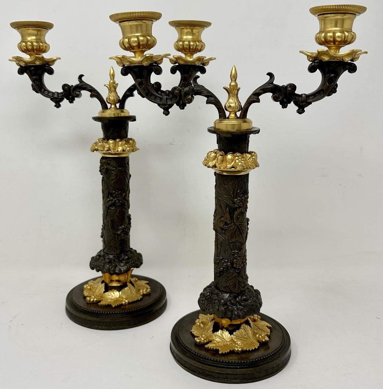 An Exceptionally Stylish Pair of Grand Tour French chisel cast Bronze and Ormolu Twin branch Candelabra of outstanding quality. Second quarter of the Nineteenth Century. 

This magnificent pair of Candelabra with twin outswept decorative arms,