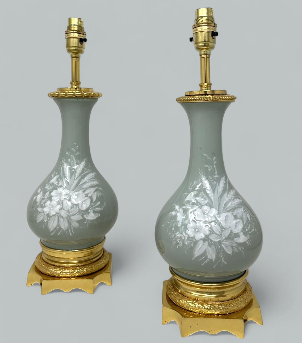 An Exceptionally Stylish Pair of Grand Tour French Pate-sur-Pate Jasperware and Ormolu mounted French Urns of Museum quality and of French origin, now converted to a Pair of Electric Table Lamps. Second quarter of the Nineteenth Century. 

This