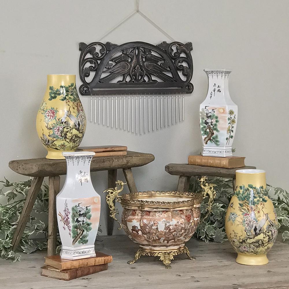 Pair of antique hand painted Chinese vases exhibit beautiful artistic scenes with exotic birds, flowers and a forest sunset enhanced by the whiteness of the Kaolin clay.
circa early 1900s
Each measures 14 H x 7 W x 5 D.