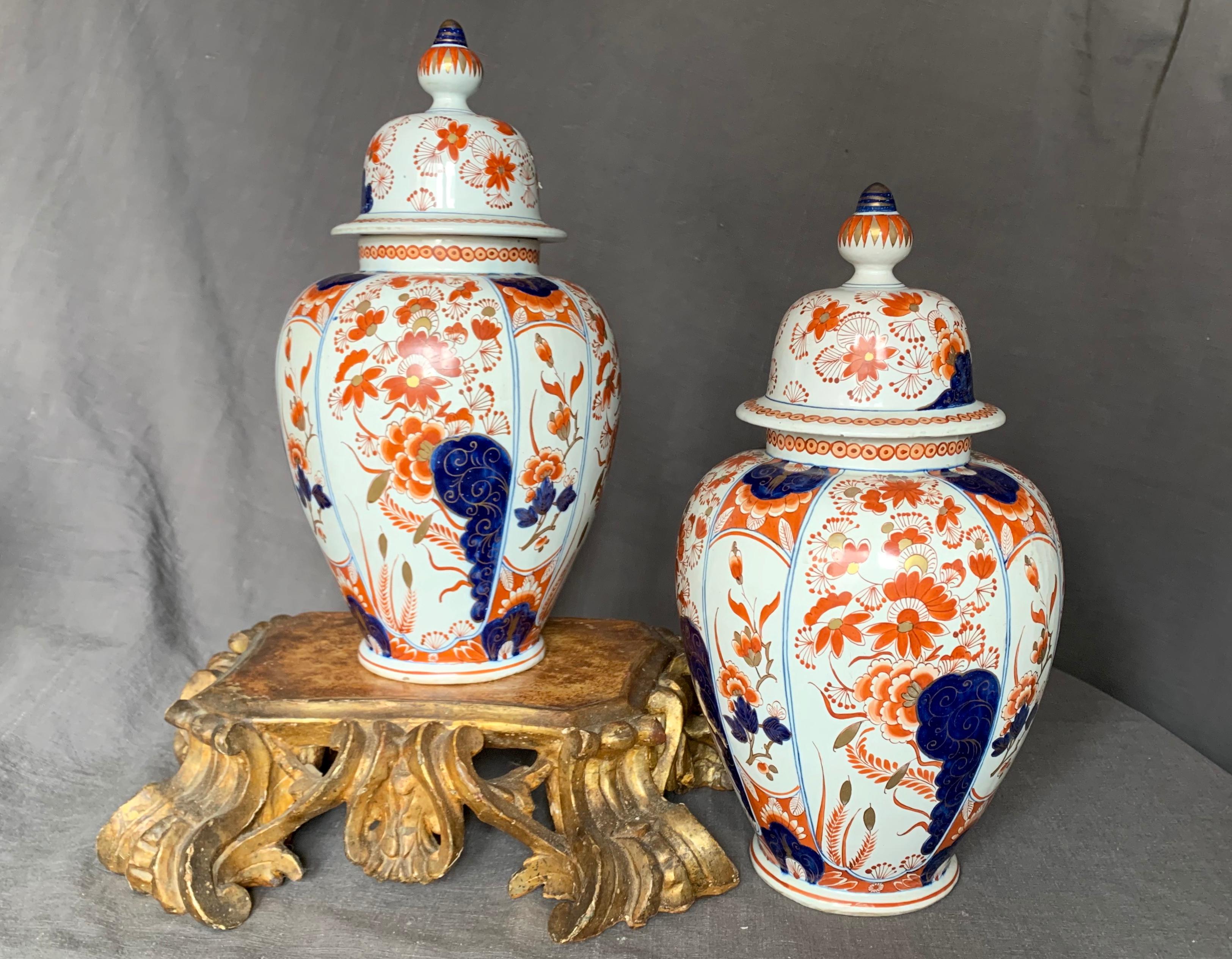 Pair Delft style Imari ginger jars. Orange, blue and gilt Imari style decoration ornaments this pair of French pottery lidded vases made by Aprey and retailed by Maison Roussat in Orleans. France, late 19th century.
Dimensions: 14.75