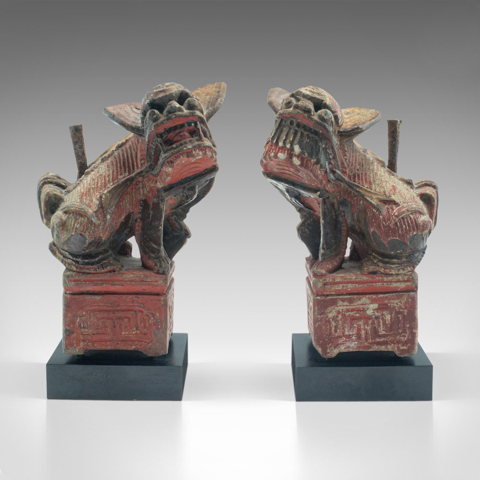 This is a pair of antique incense burners. An Oriental, decorative stone censer or guardian lion bookends, dating to the late Victorian period, circa 1900.

Fascinating guardian lion figures with incense burning chimneys
Displays a desirable aged