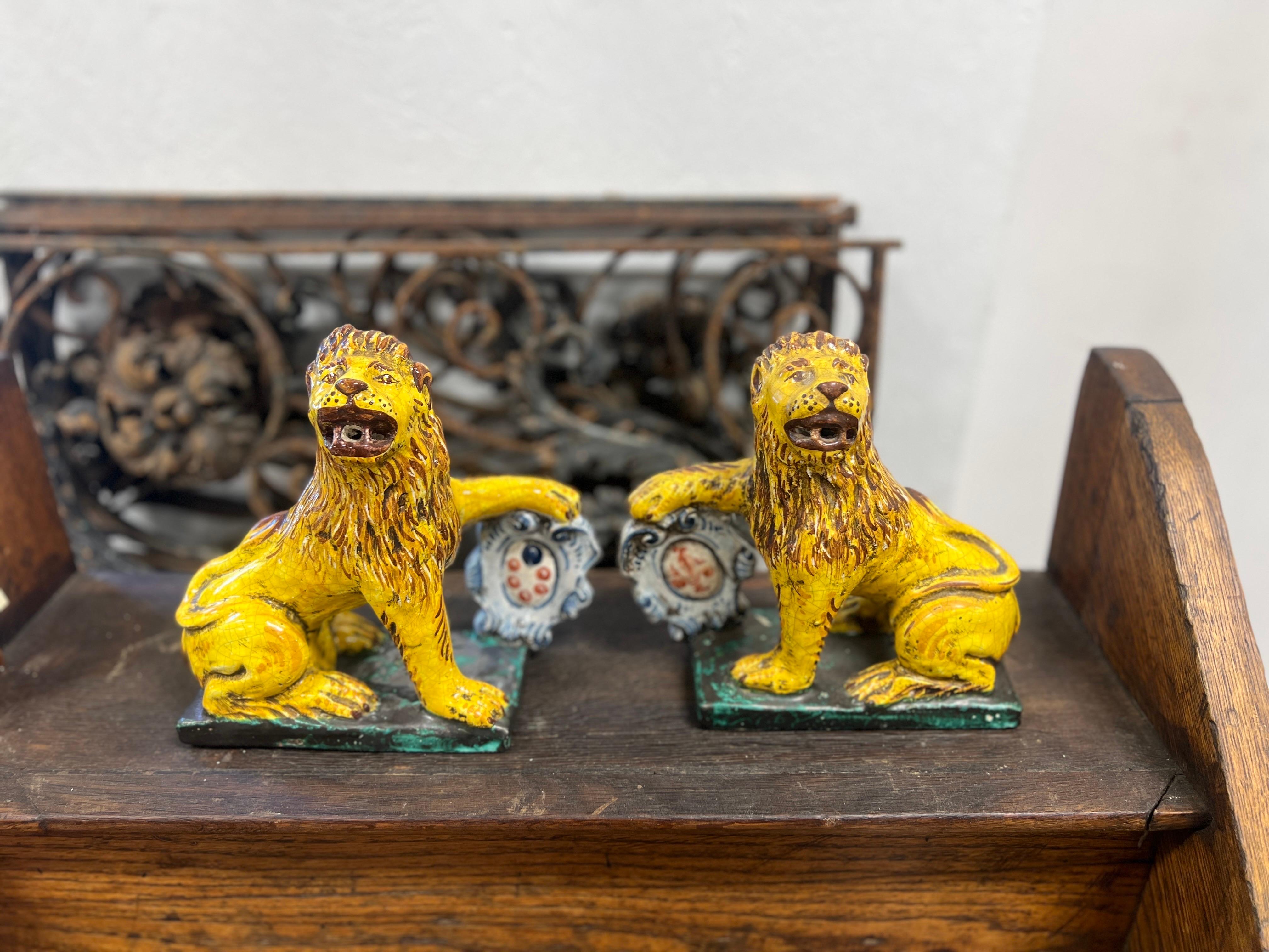 Pair, Antique Italian Faience Renaissance Style Lions W/ Armorial Shields.

A wonderful pair of Italian faience Lions with armorial shields and a hand painted surface. Apparently unmarked.