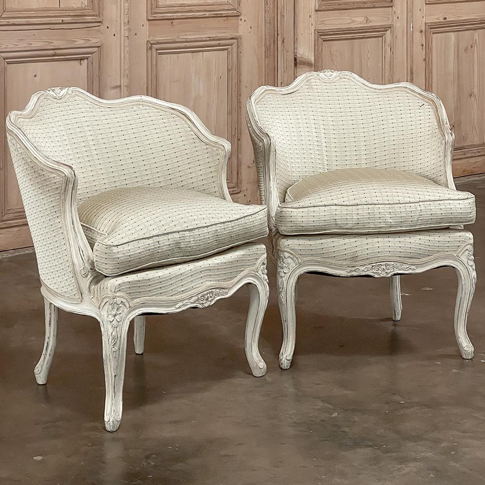 Pair Antique Italian Painted Petite Armchairs were crafted on a diminutive scale, making the pair perfect for cozy seating groups, the bedroom or as accent chairs. The undulating form of the framework completely wraps around the seatback design,