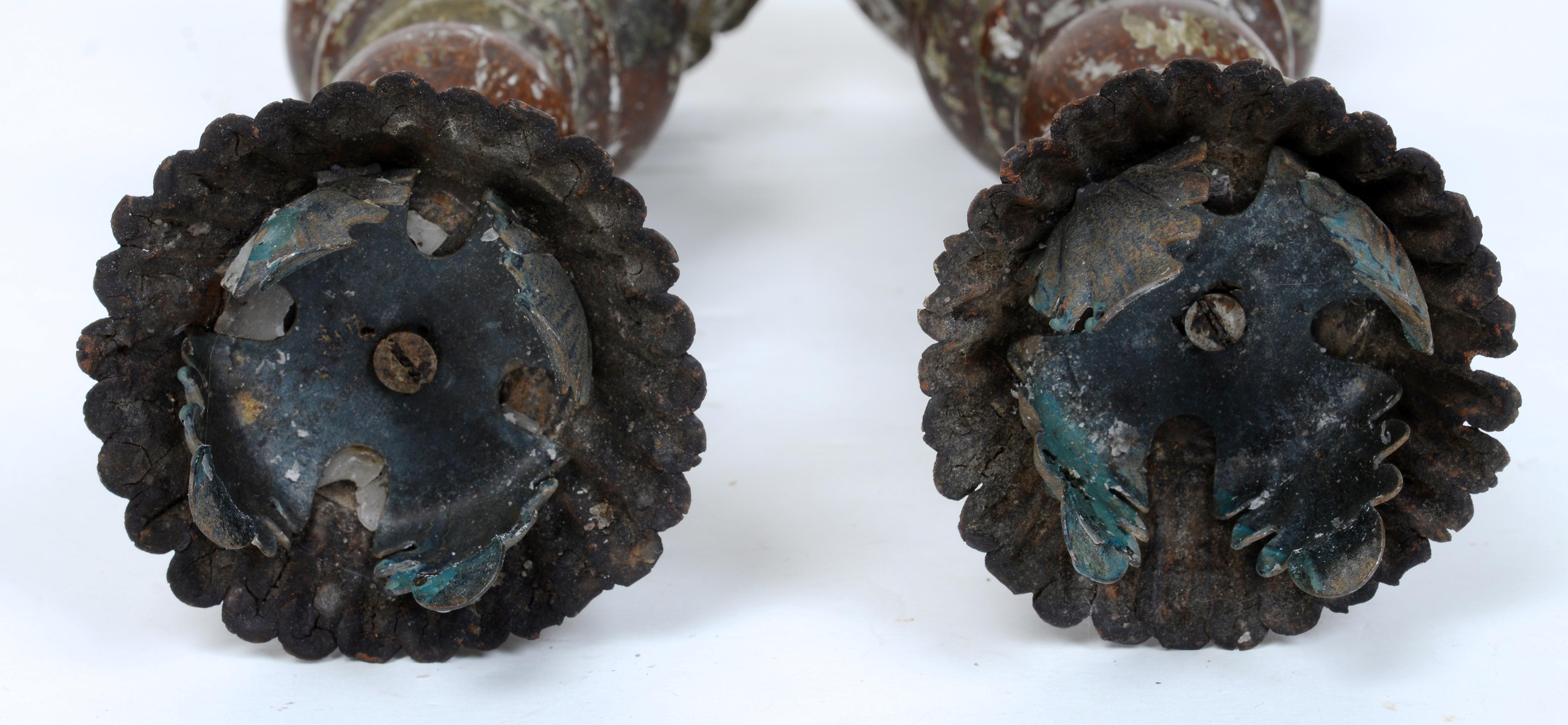 A Pair of Antique Italian Turned and Paint Decorated Wooden Candlesticks Late 18th c. Original polychrome decoration in green and red with a sculptural crown shaped painted tole top and leaf shaped candle holders above a spiral turned central column